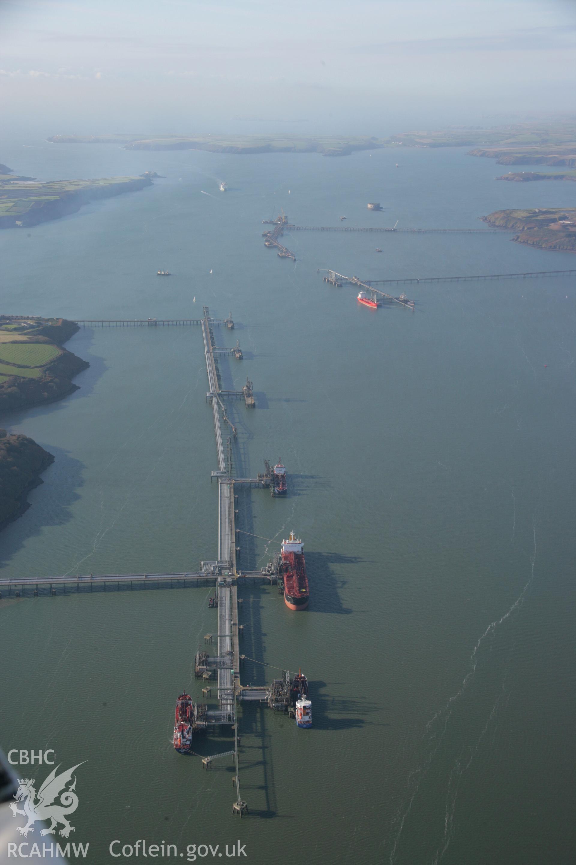 RCAHMW colour oblique aerial photograph of Bullwell Bay Jetty, Texaco Oil Refinery, Rhoscrowther, Milford Haven. Viewed from the east. Taken on 19 November 2005 by Toby Driver