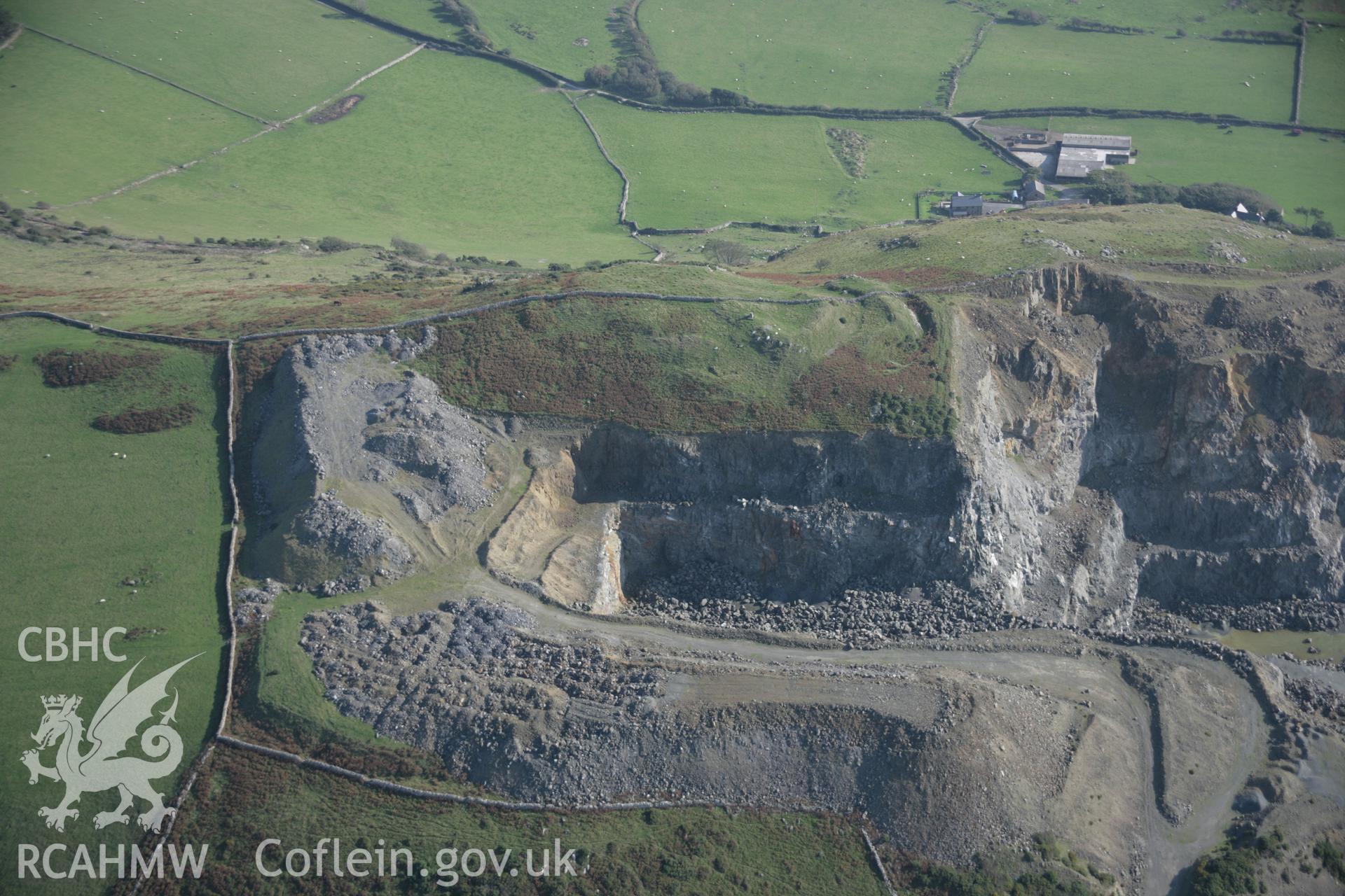 RCAHMW colour oblique aerial photograph of Tal-y-Gareg Hillfort and nearby quarry from the north-west. Taken on 17 October 2005 by Toby Driver