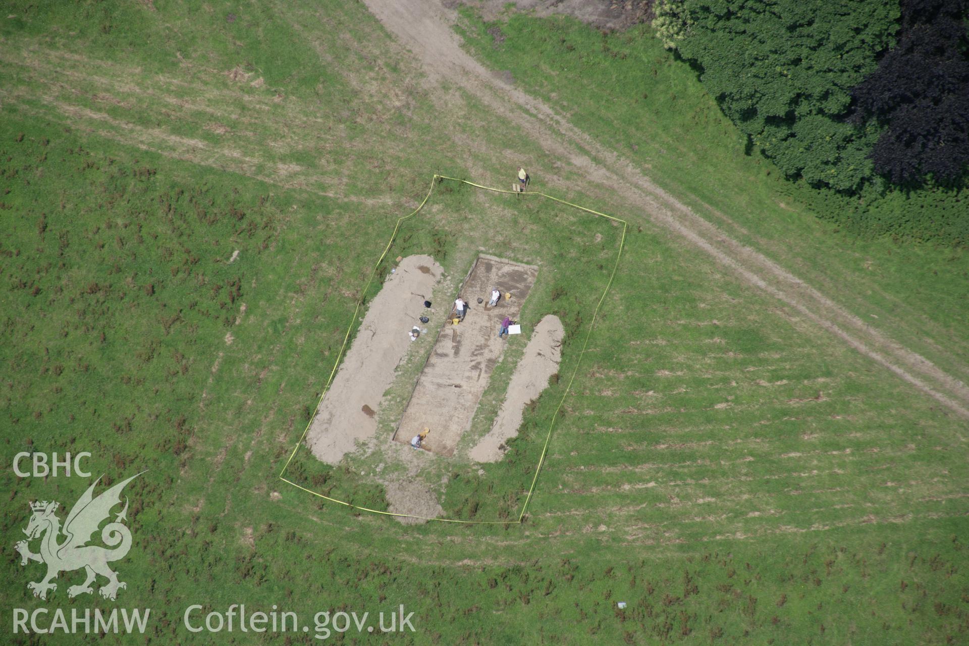 RCAHMW colour oblique aerial photograph of Dinefwr Park Roman Forts. The excavation trench at SN 6228 2250. Taken on 11 July 2005 by Toby Driver