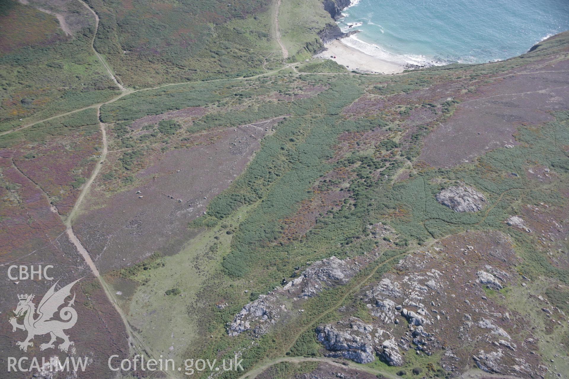 RCAHMW digital colour oblique photograph of Carn Llidi Enclosures viewed from the north-east with vestiges of field systems. Taken on 01/09/2005 by T.G. Driver.