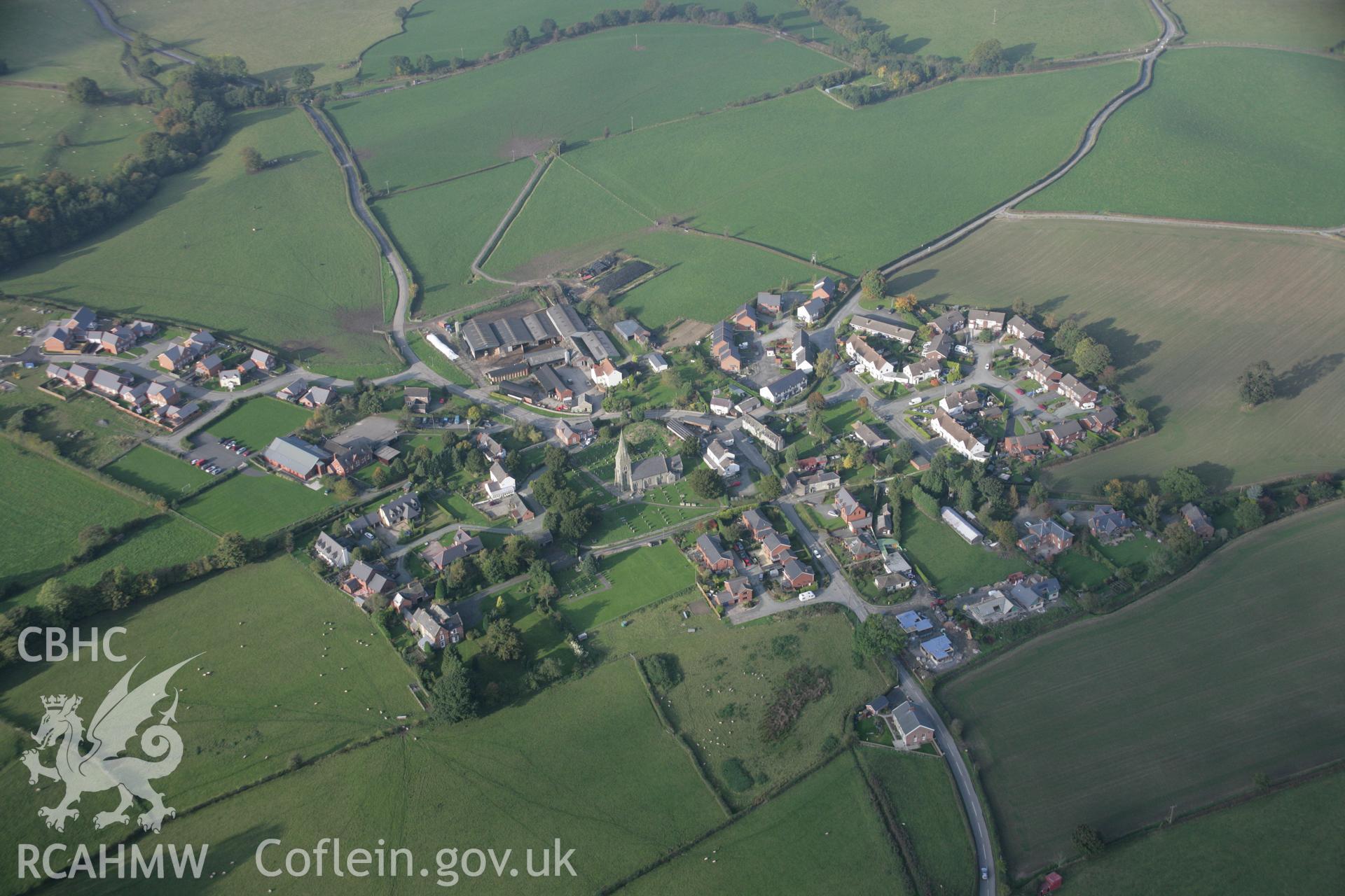 RCAHMW colour oblique aerial photograph of Castle Caereinion Castle and village from the south. Taken on 17 October 2005 by Toby Driver