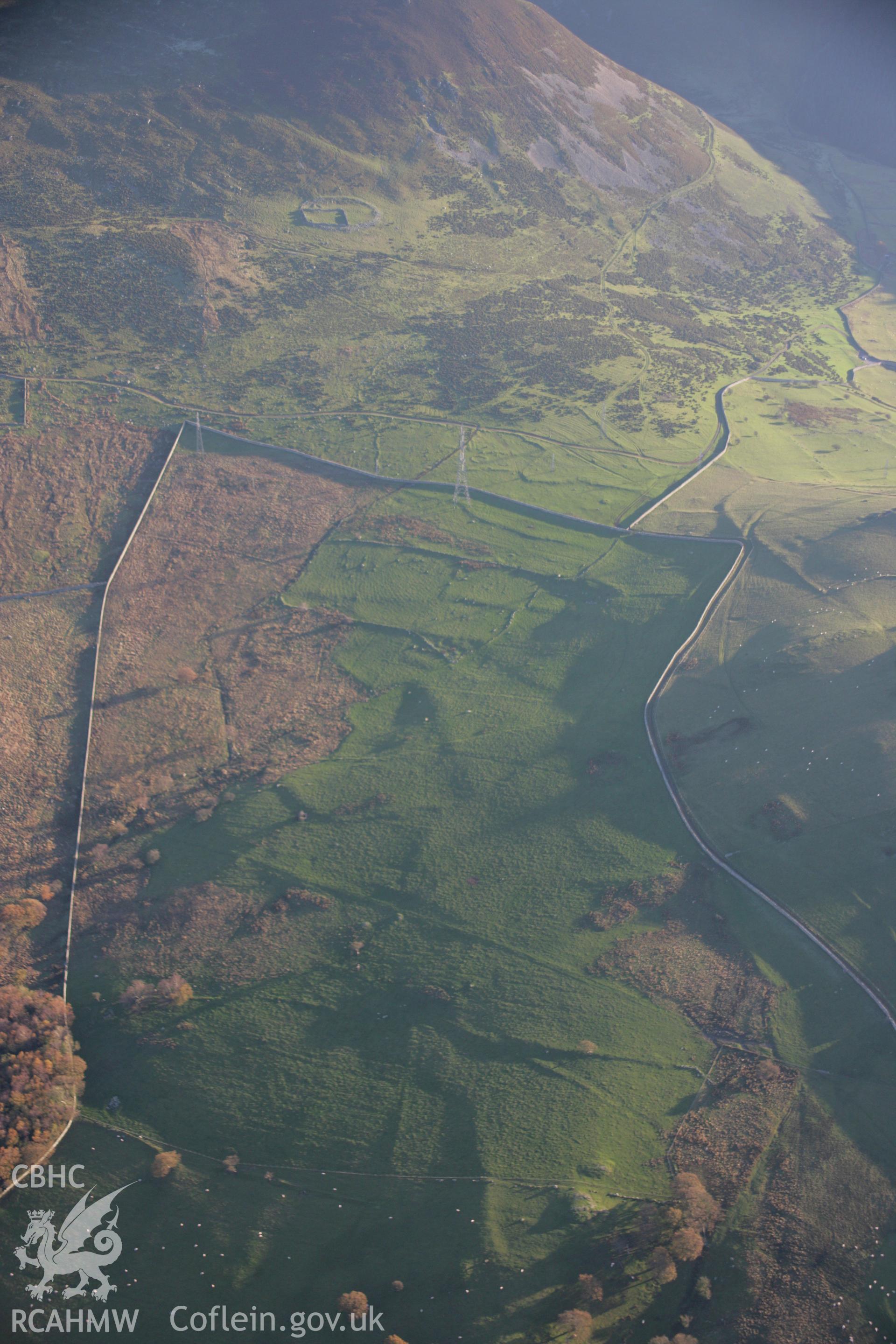 RCAHMW colour oblique aerial photograph of a hut group 750m southeast of Bod Silin from the north. Taken on 21 November 2005 by Toby Driver