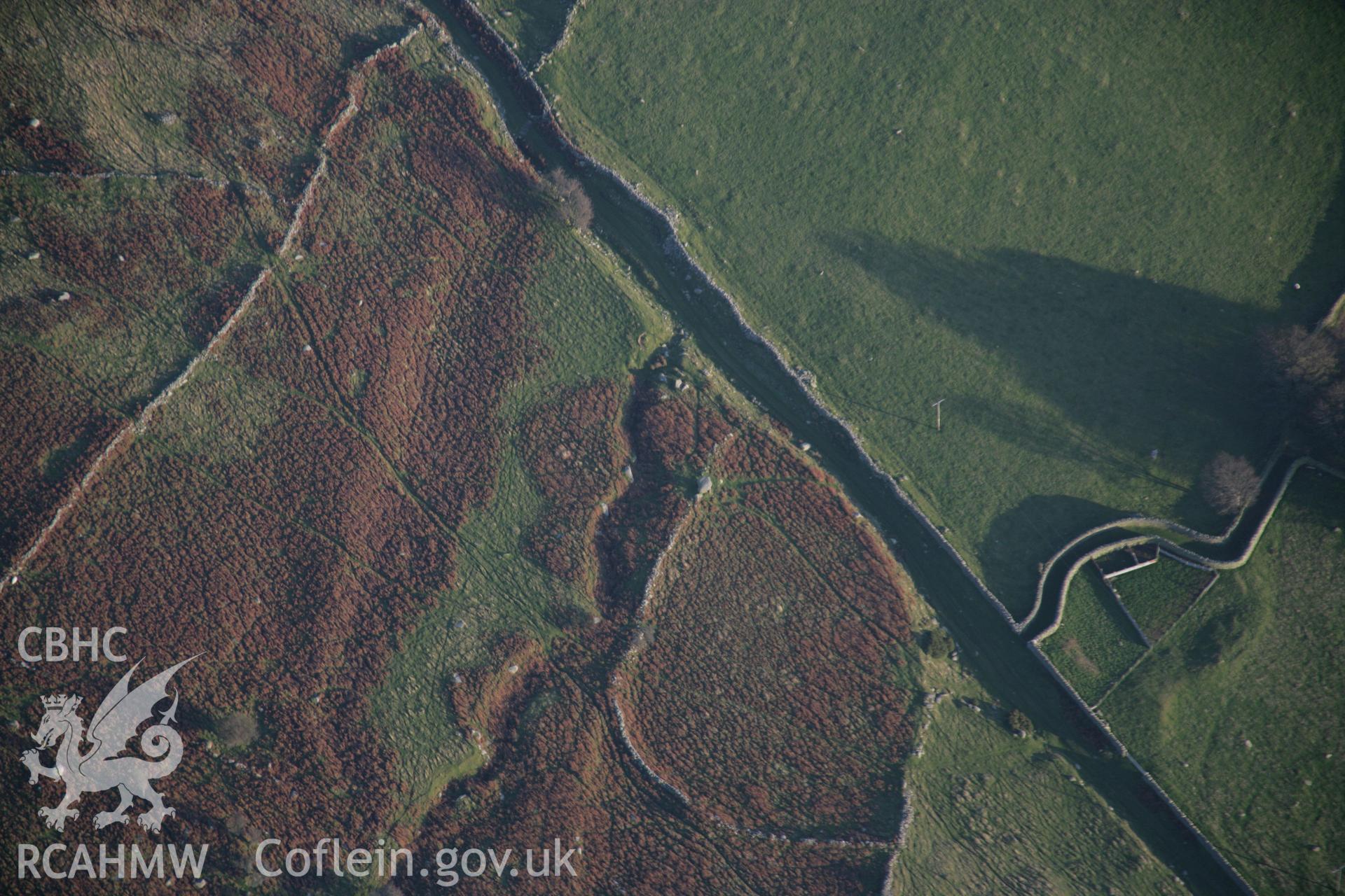 RCAHMW colour oblique aerial photograph of Maen-y-Bardd Neolithic Burial Chamber, chambered tomb, in high view from the north-west. Taken on 21 November 2005 by Toby Driver