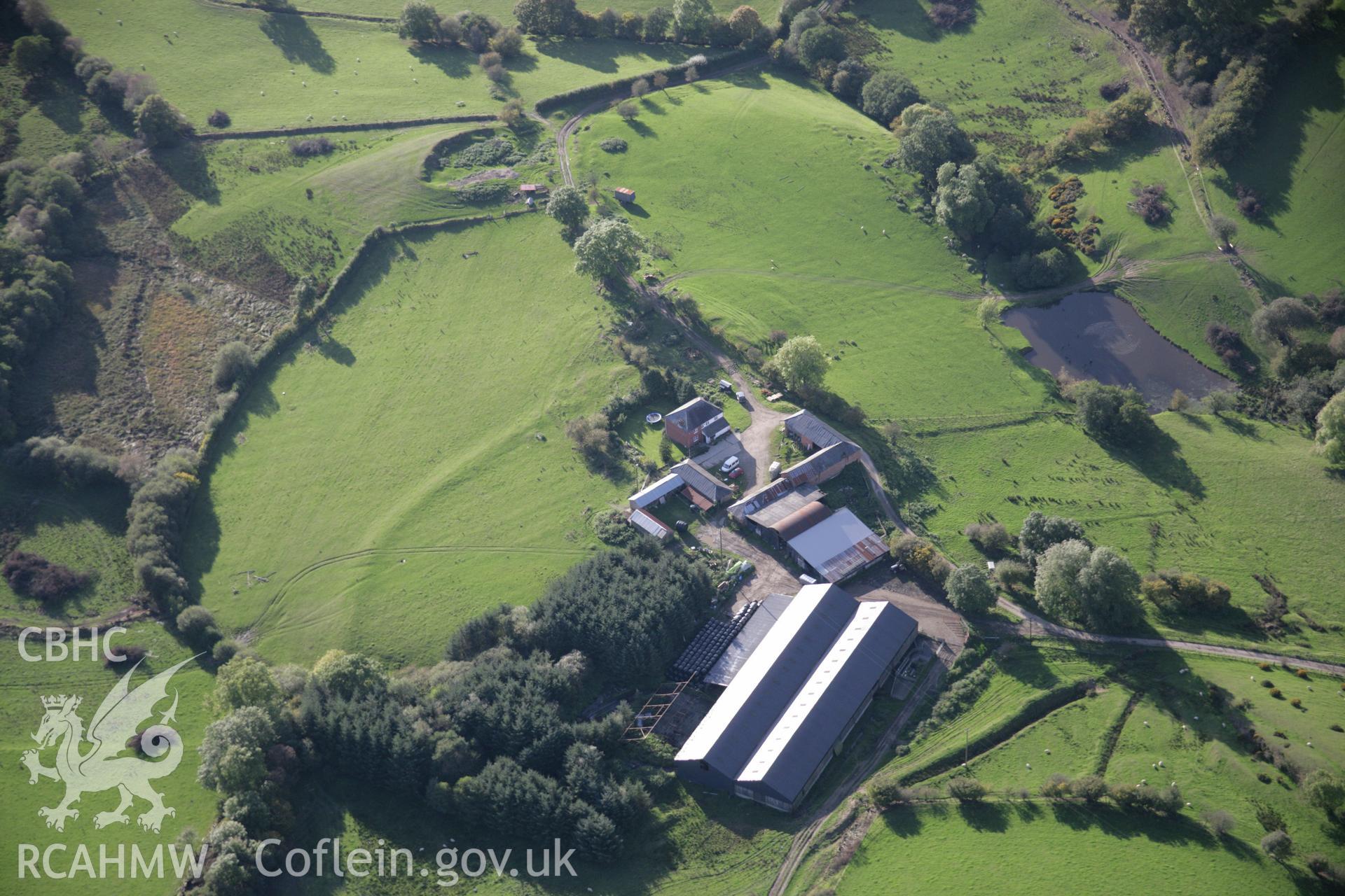 RCAHMW colour oblique aerial photograph of Cwm-Cefn-y-Gaer Farmstead, west of Heartsease, with the earthwork of a possible fort or relict field boundary. Viewed from the east. Taken on 13 October 2005 by Toby Driver