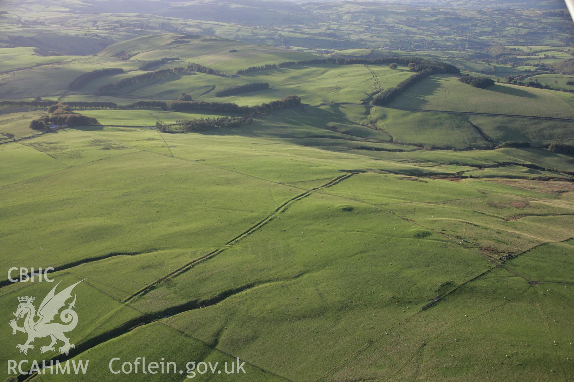 RCAHMW colour oblique aerial photograph of Two Tumps Dyke II and nearby barrows, viewed looking north-west. Taken on 13 October 2005 by Toby Driver