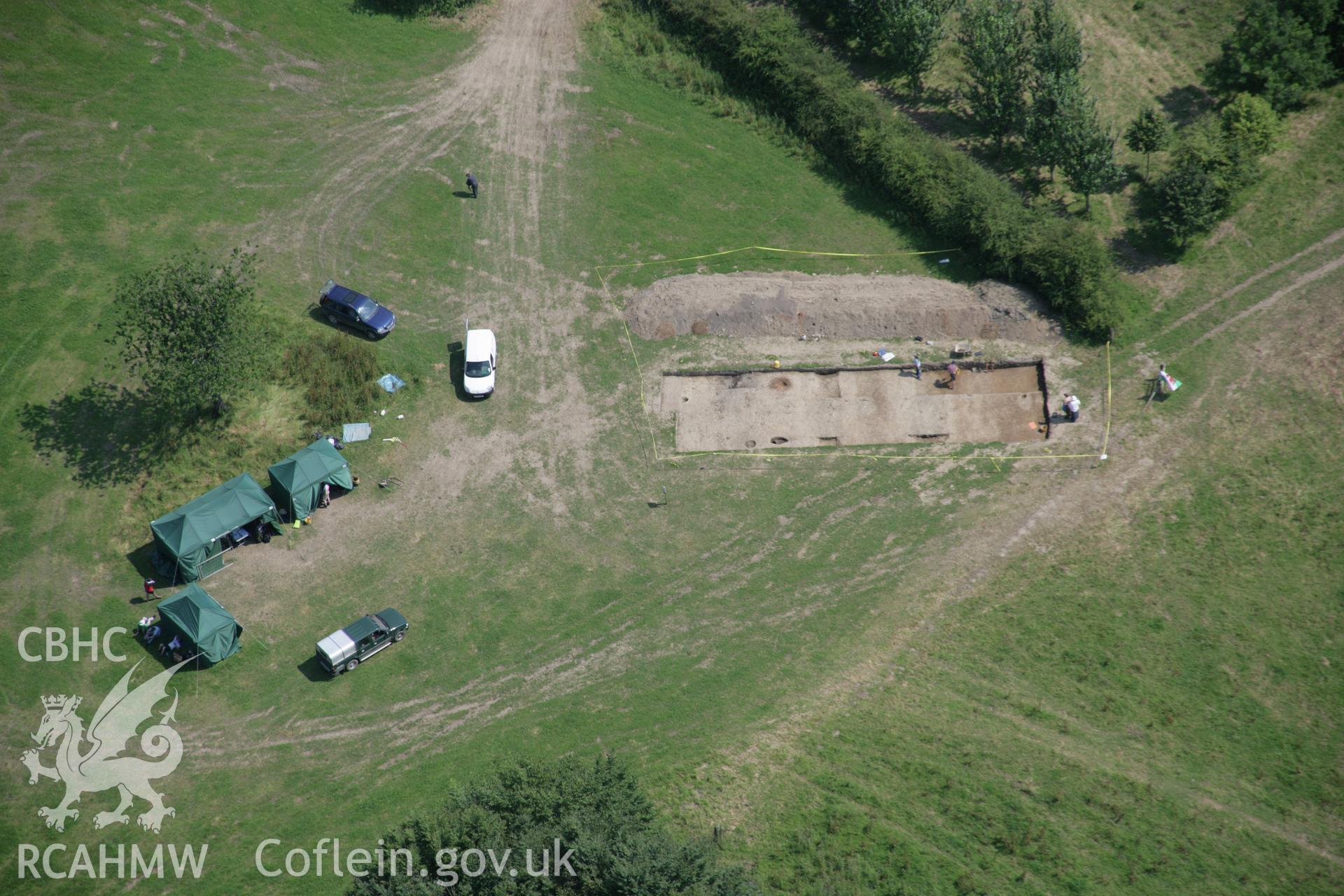 RCAHMW colour oblique aerial photograph of Dinefwr Park Roman Forts. The excavation trench at SN 6217 2256, with dig tents, viewed from the west. Taken on 11 July 2005 by Toby Driver