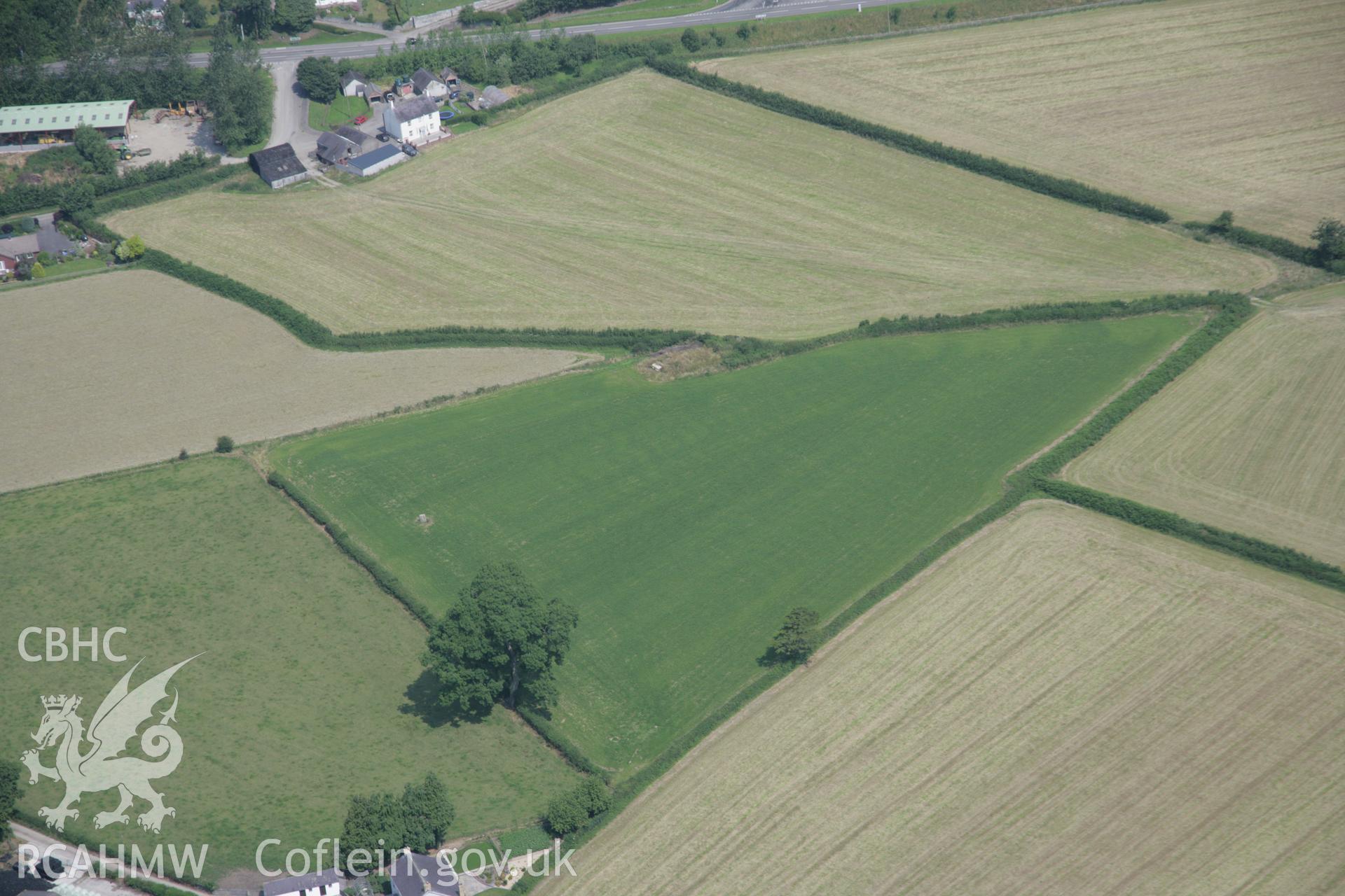 RCAHMW colour oblique aerial photograph of a round barrow 200m south southwest of Felin-Wen-Isaf. Taken on 11 July 2005 by Toby Driver