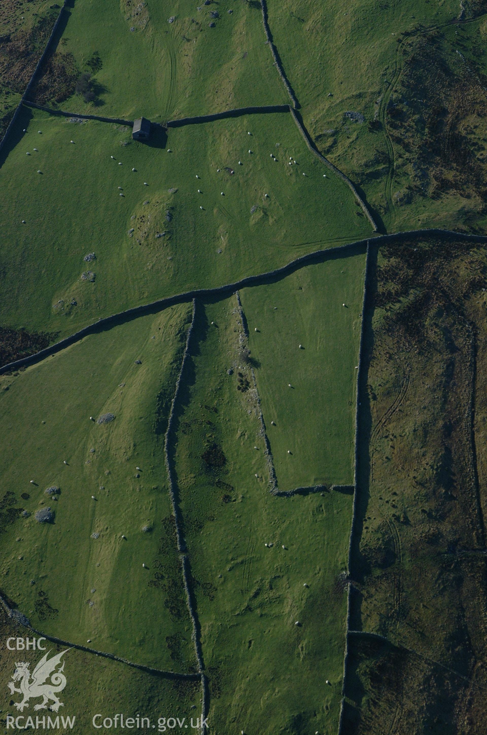 RCAHMW colour oblique aerial photograph of an enclosed Homestead south of Yr Onen. Taken on 24 January 2005 by Toby Driver