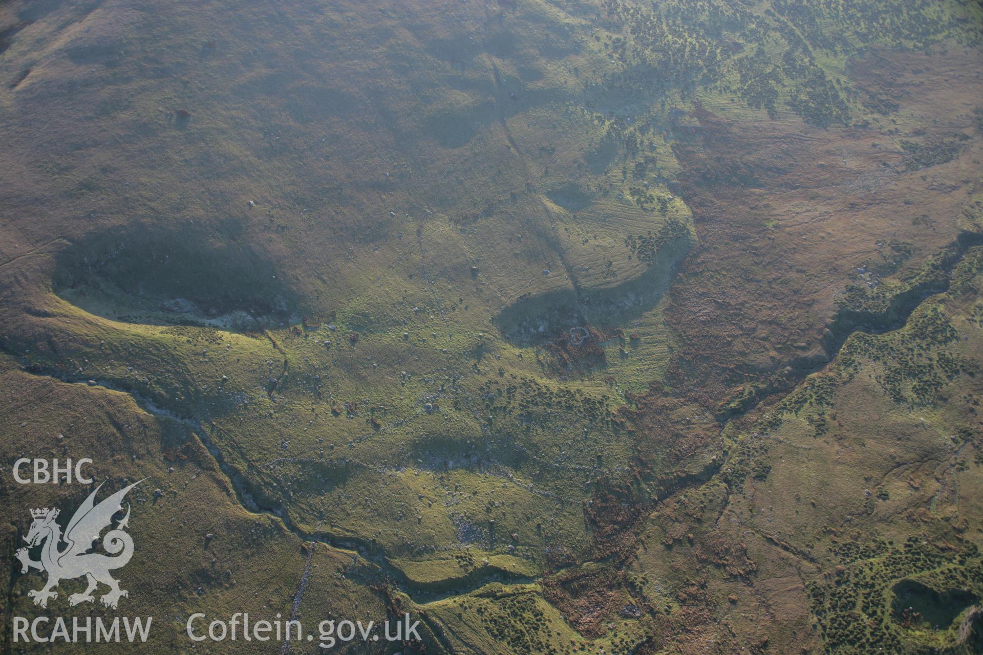 RCAHMW colour oblique aerial photograph of a hut circle at Twll Pant-Hiriol viewed from the north. Taken on 21 November 2005 by Toby Driver