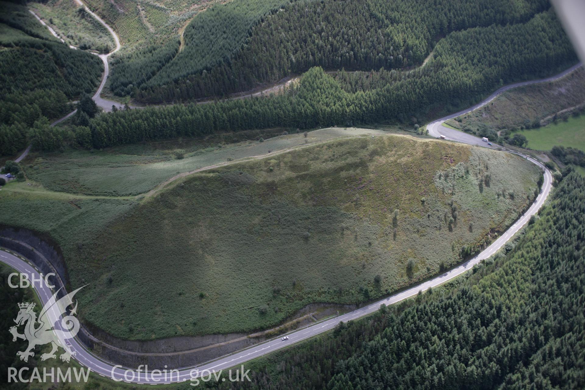 RCAHMW colour oblique aerial photograph of Sugar Loaf Hillfort from the north-west. Taken on 02 September 2005 by Toby Driver