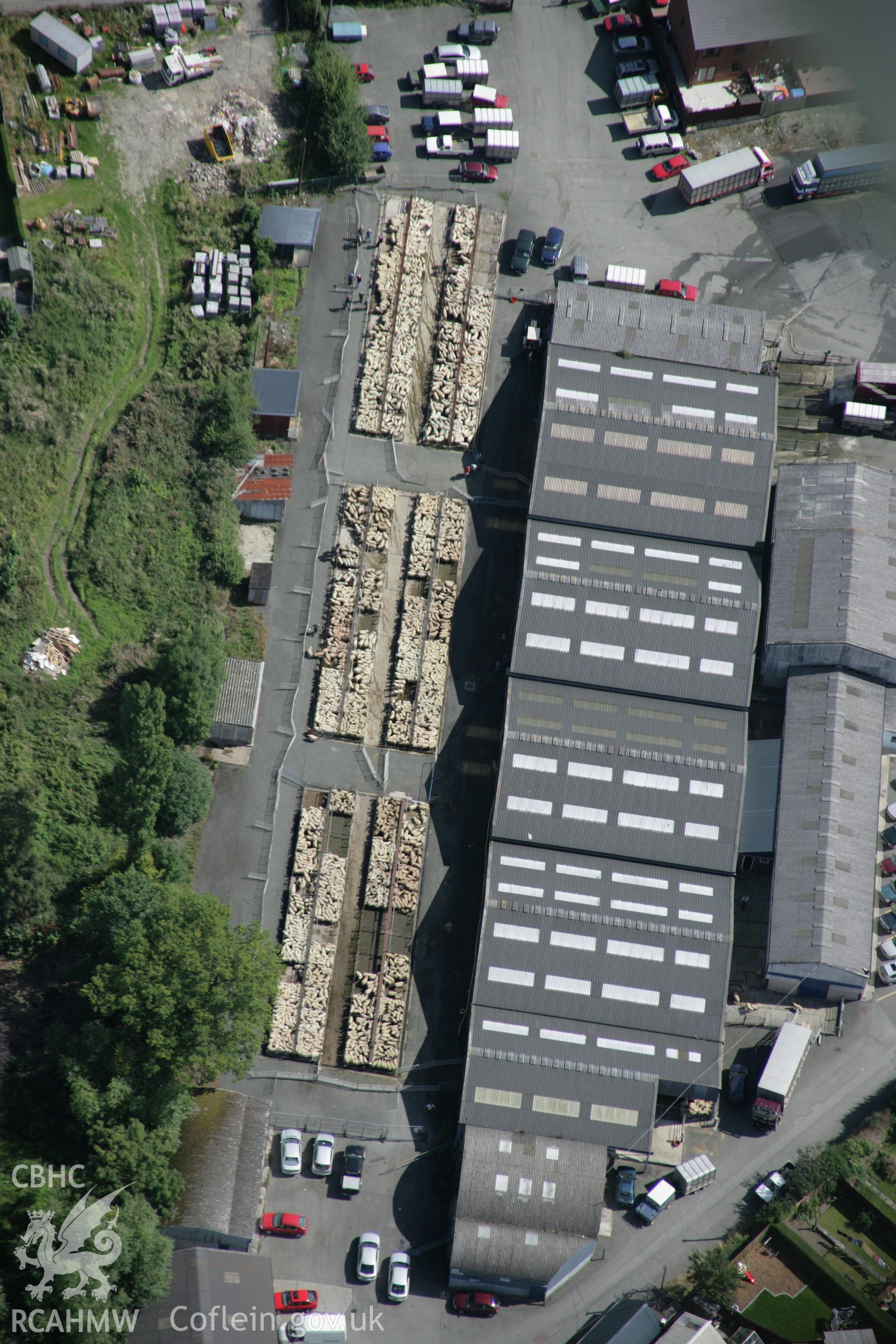 RCAHMW colour oblique aerial photograph of the cattle market in Builth Wells from the west. Taken on 02 September 2005 by Toby Driver