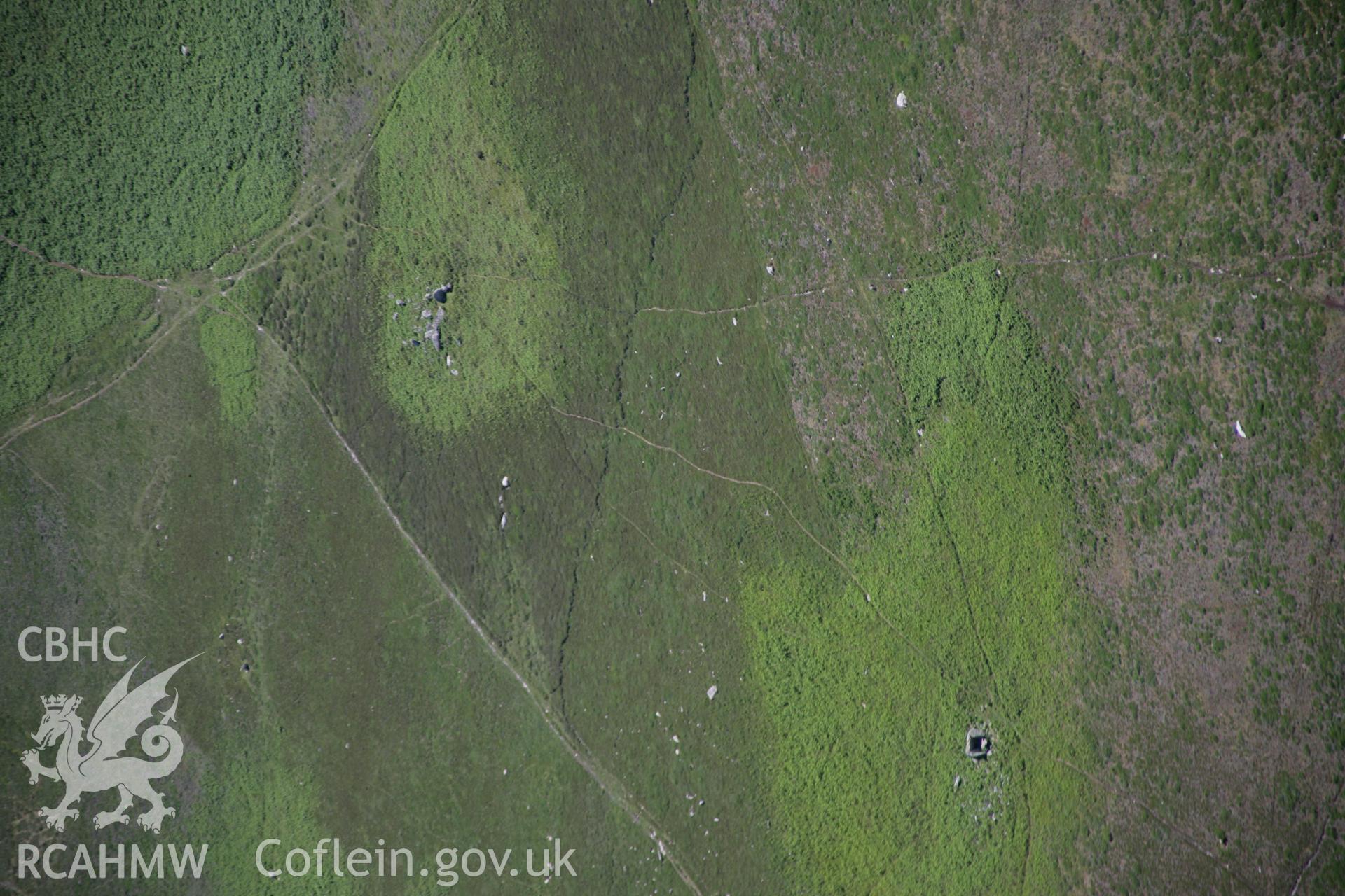 RCAHMW colour oblique aerial photograph of Sweyne's Howes North Cairn, with the south cairn beyond. Taken on 22 June 2005 by Toby Driver