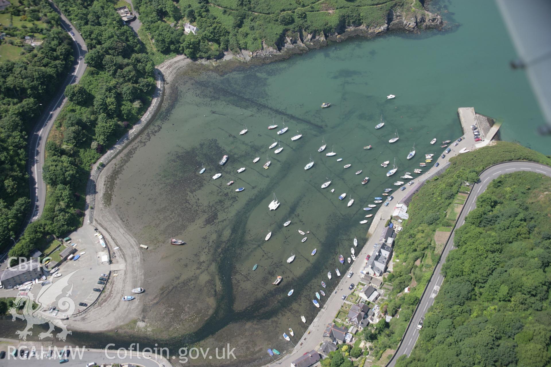 RCAHMW colour oblique aerial photograph of Fishguard Quay. A view from the south-east with intertidal structures visible through the water. Taken on 11 July 2005 by Toby Driver