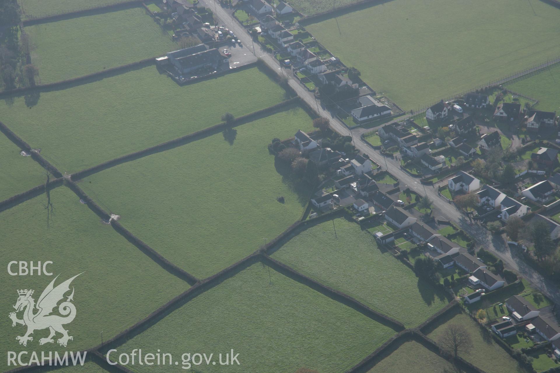 RCAHMW colour oblique photograph of Ffynnon newydd henge, view from north-east. Taken by Toby Driver on 17/11/2005.