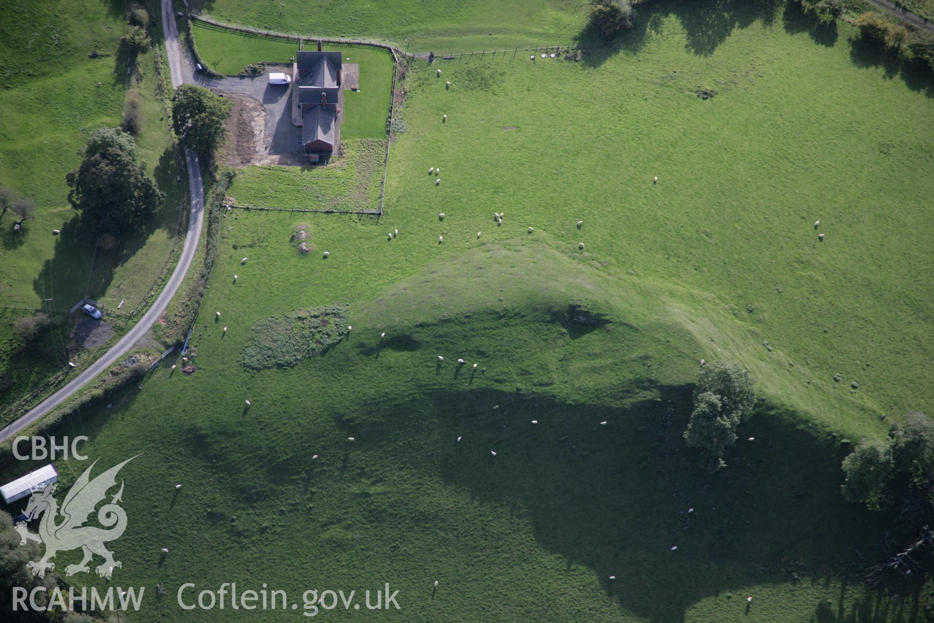 RCAHMW colour oblique aerial photograph of Neuadd longhouse and earthworks on crest of ridge, viewed from the south. Taken on 13 October 2005 by Toby Driver