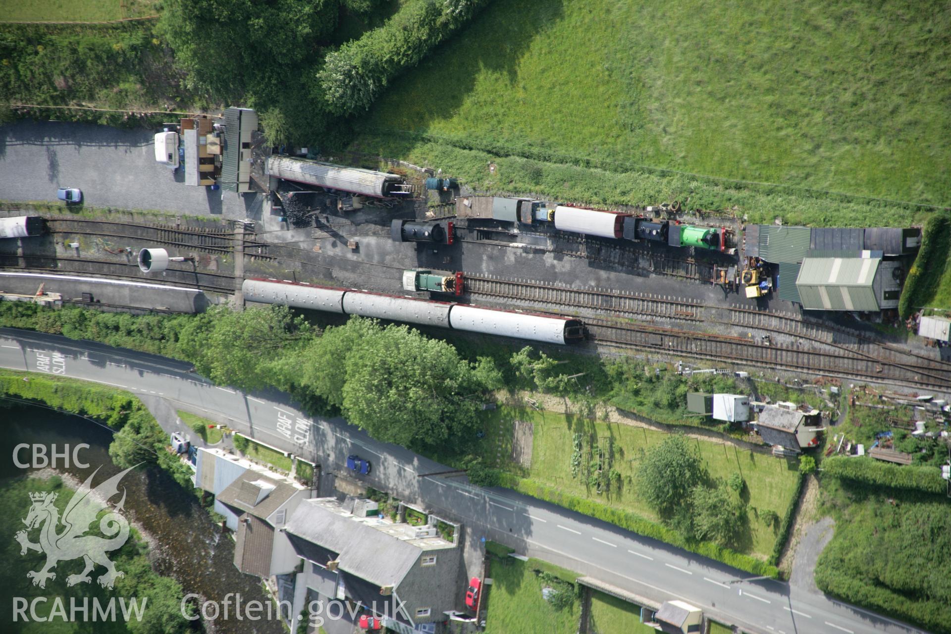 RCAHMW colour oblique aerial photograph of Bronwydd Arms Railway Station, Carmarthen and Cardigan Railway, from the south. Taken on 09 June 2005 by Toby Driver