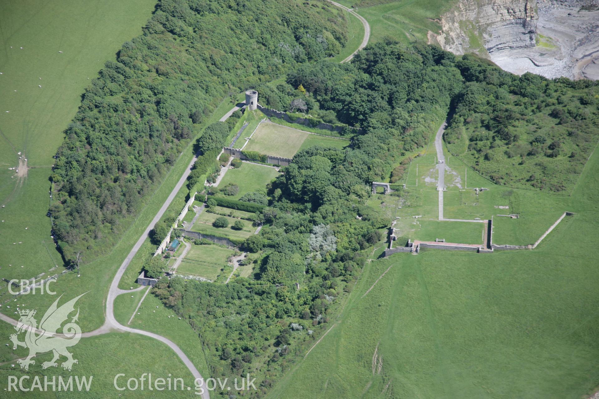 RCAHMW colour oblique aerial photograph of Dunraven Castle and its walled garden.. Taken on 22 June 2005 by Toby Driver