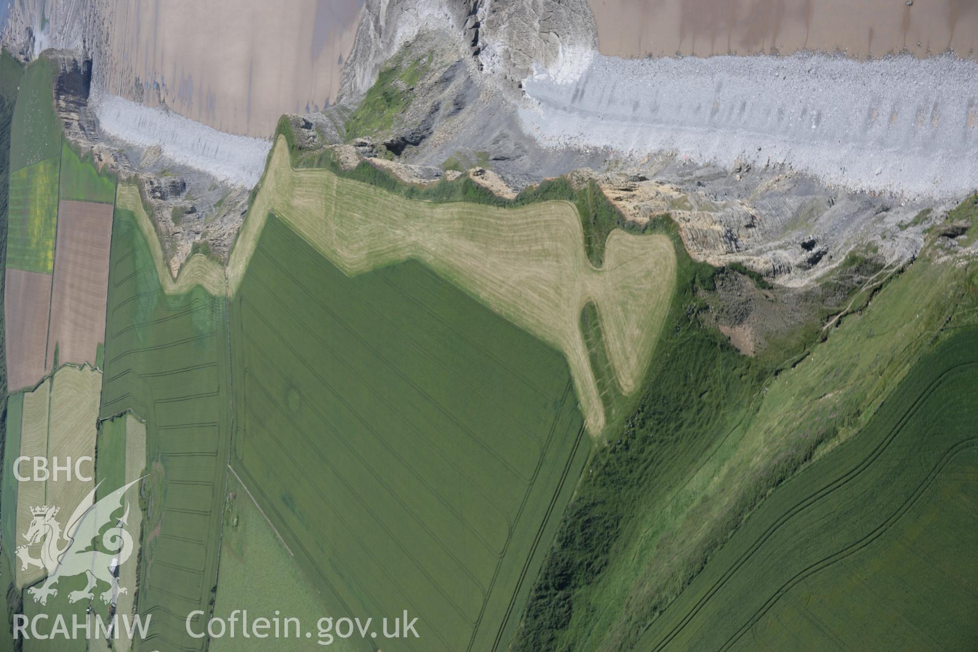 RCAHMW colour oblique aerial photograph of Cwm Bach Enclosure from the north-west. Taken on 22 June 2005 by Toby Driver