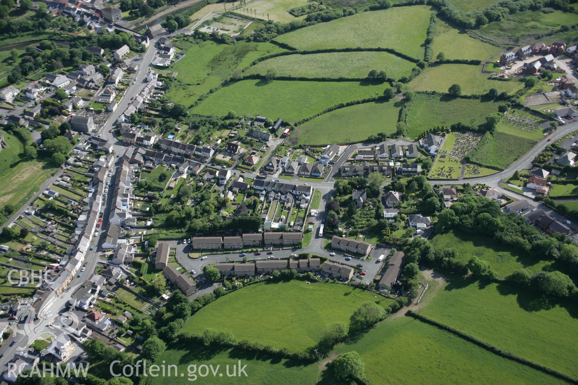 RCAHMW colour oblique aerial photograph of Kidwelly showing part of the medieval town, viewed from the north. Taken on 09 June 2005 by Toby Driver