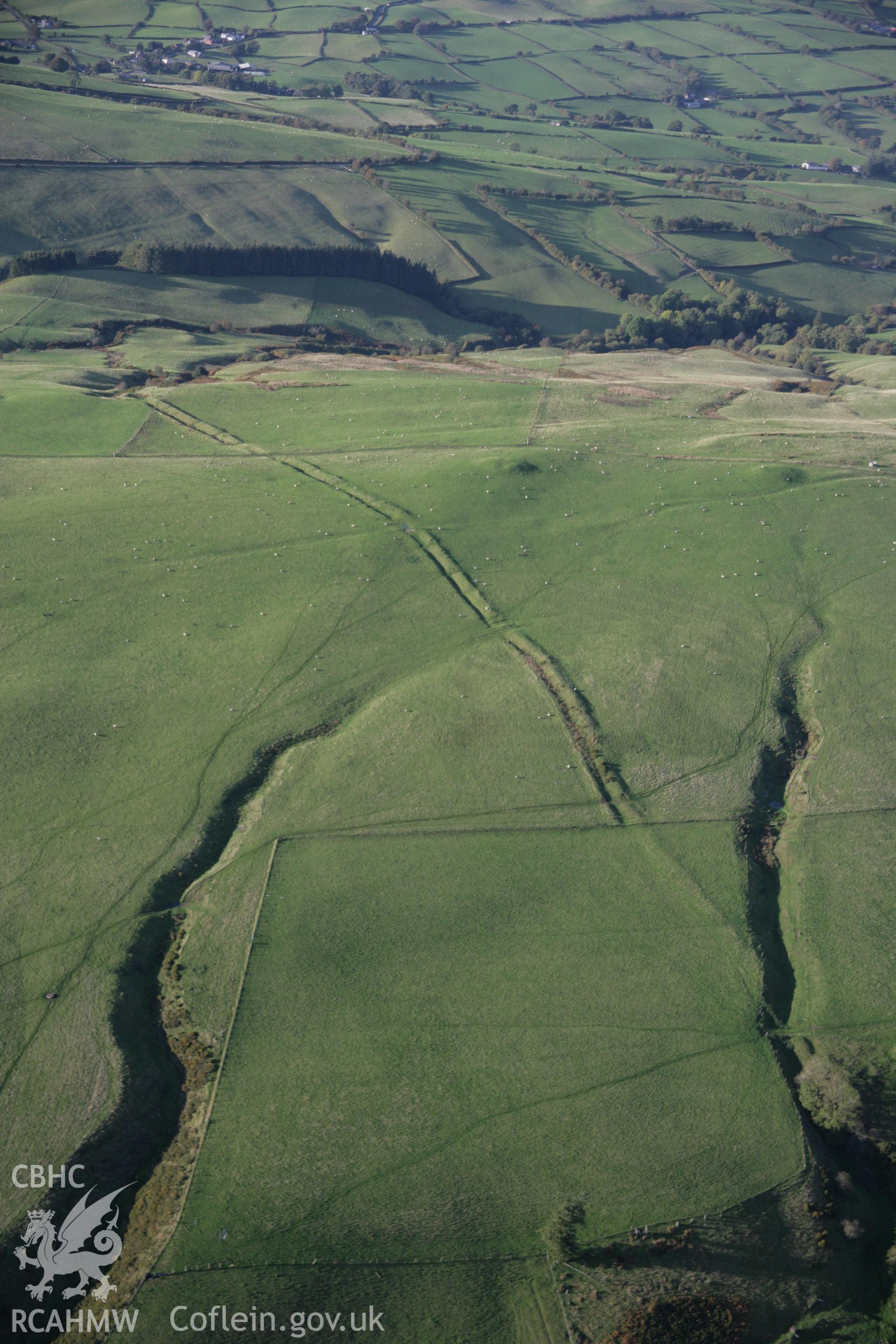 RCAHMW colour oblique aerial photograph of Two Tumps Dyke II and nearby barrows, viewed looking north-west. Taken on 13 October 2005 by Toby Driver