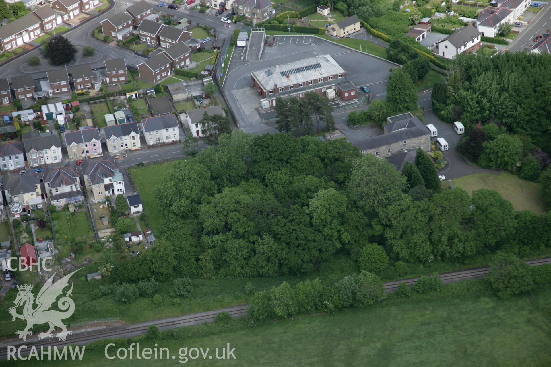 RCAHMW colour oblique aerial photograph of Tir-y-Dail Motte and Bailey, Ammanford, Rhydaman. Taken on 09 June 2005 by Toby Driver