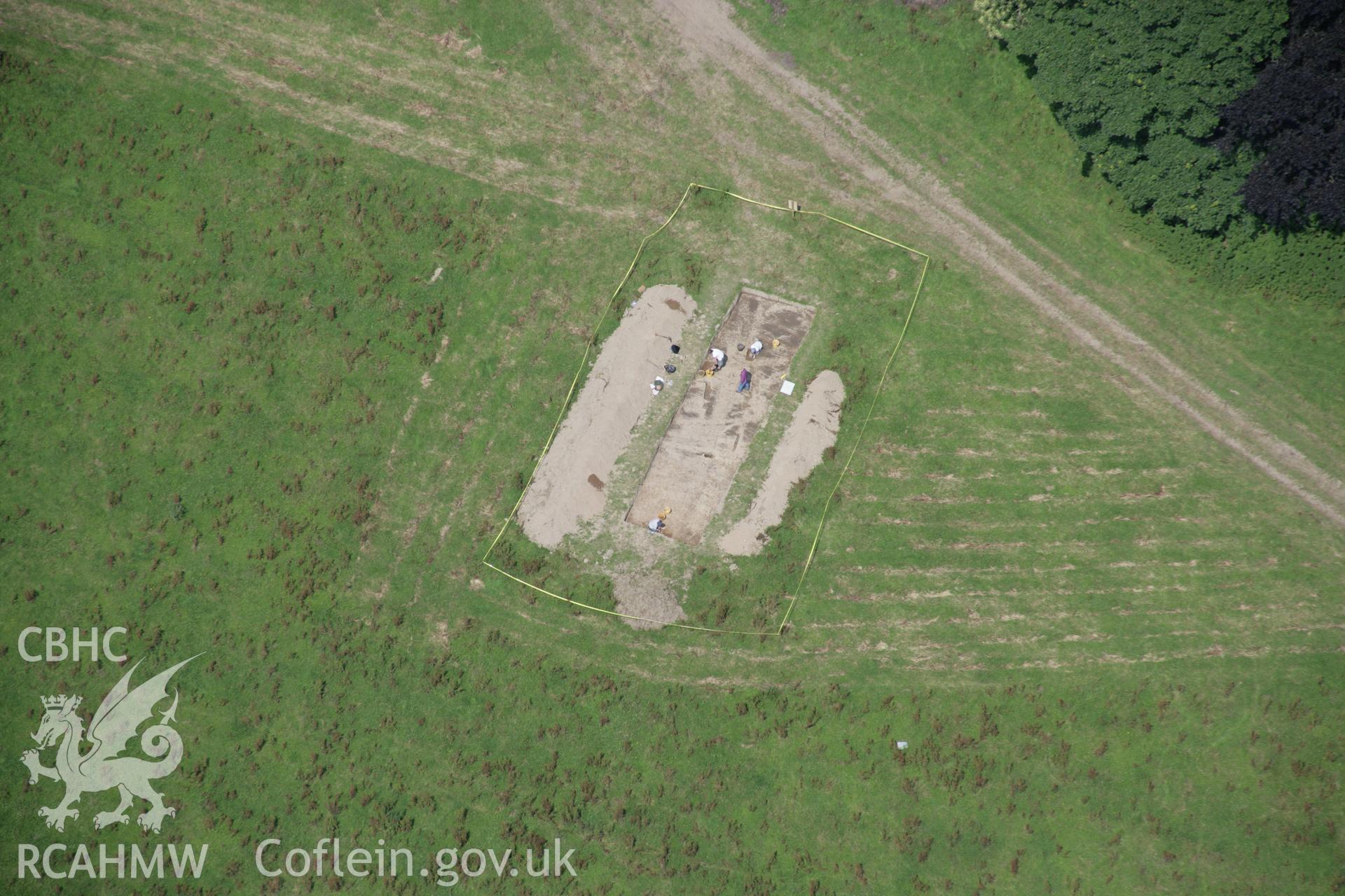 RCAHMW colour oblique aerial photograph of Dinefwr Park Roman Forts. The excavation trench at SN 6207 2241. Taken on 11 July 2005 by Toby Driver