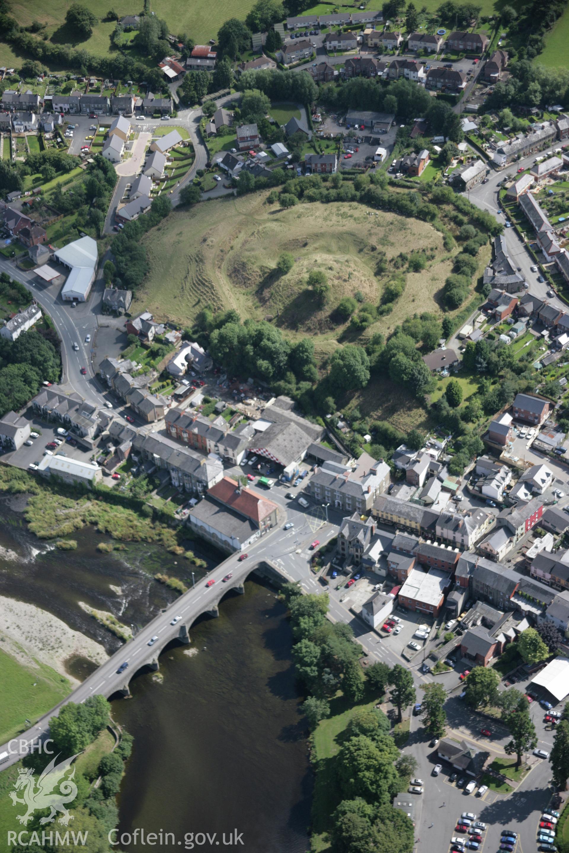 RCAHMW colour oblique aerial photograph of Builth Bridge and castle from the west. Taken on 02 September 2005 by Toby Driver