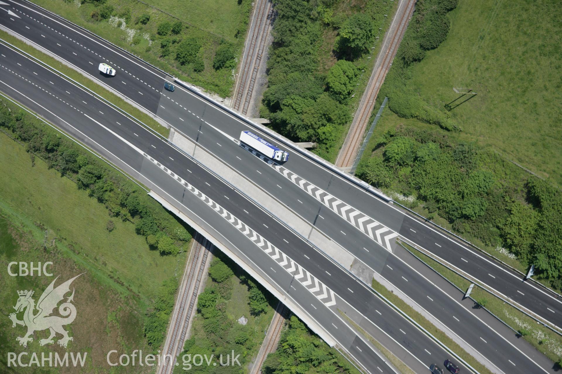 RCAHMW colour oblique aerial photograph of Hendy Interchange at Junction 48 of the  M4 Motorway viewed from the west. Taken on 09 June 2005 by Toby Driver