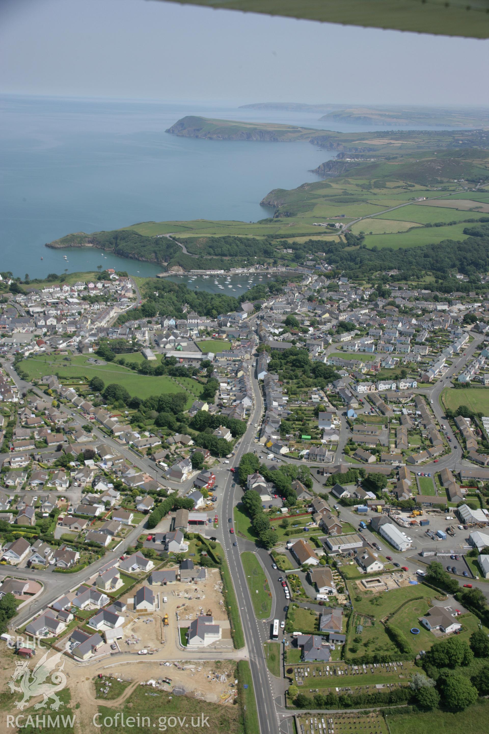 RCAHMW colour oblique aerial photograph of Fishguard. A general view from the south-west with the North Pembrokeshire coast beyond. Taken on 11 July 2005 by Toby Driver