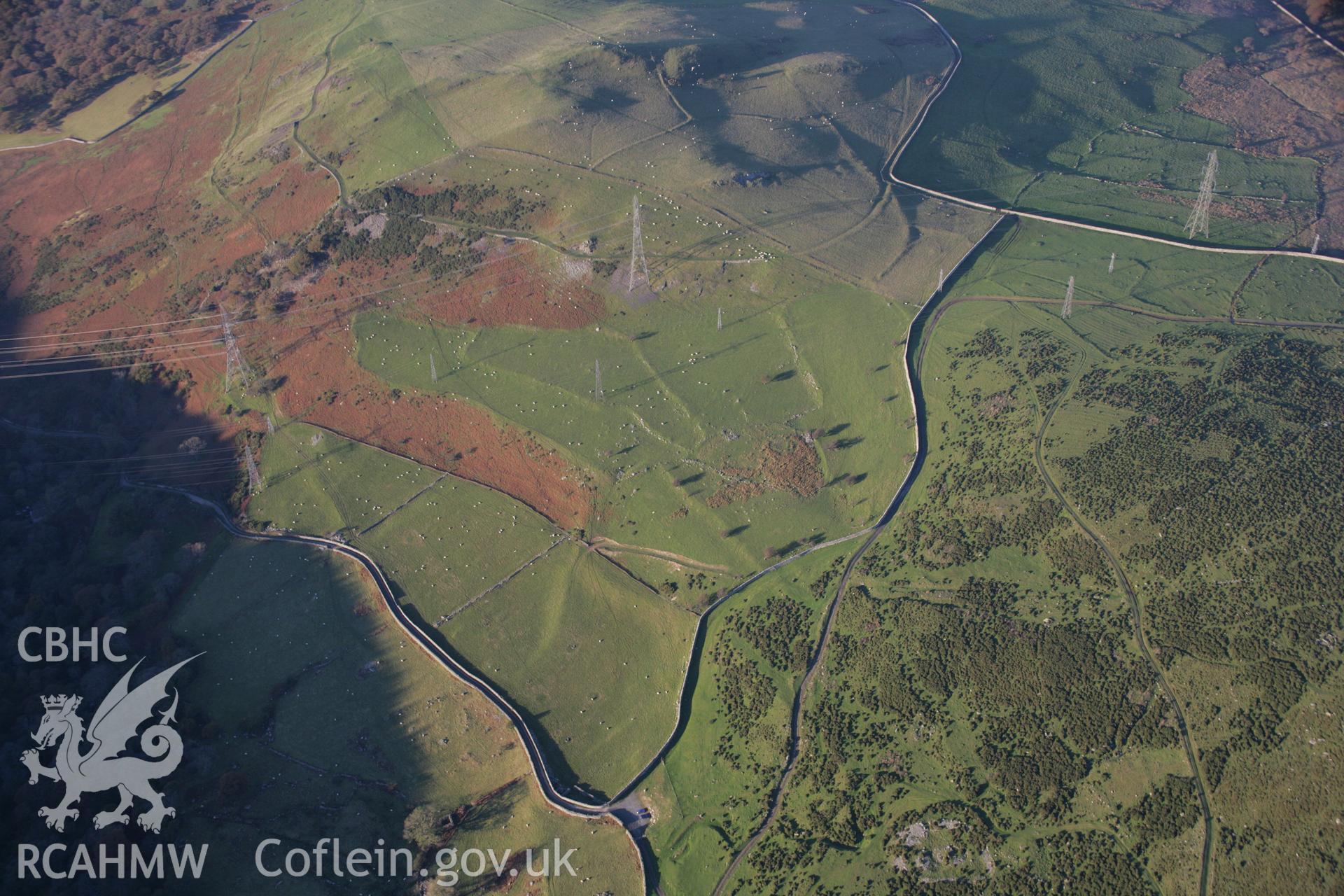 RCAHMW colour oblique aerial photograph of the Wern-y-Pandy Longhouse on the north side of the Anafan Valley from the south-west. Taken on 21 November 2005 by Toby Driver