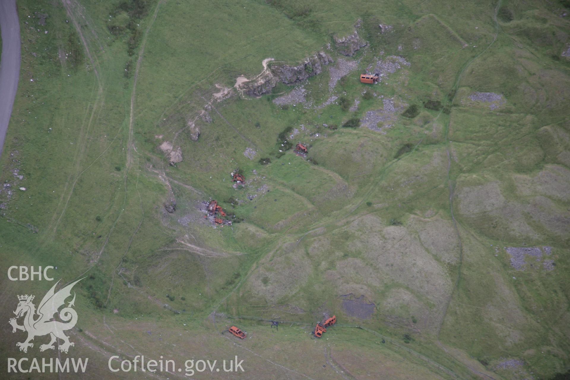 RCAHMW colour oblique aerial photograph of a deserted iron mining village at Ffos-y-Fran. Viewed in poor light. Taken on 07 July 2005 by Toby Driver