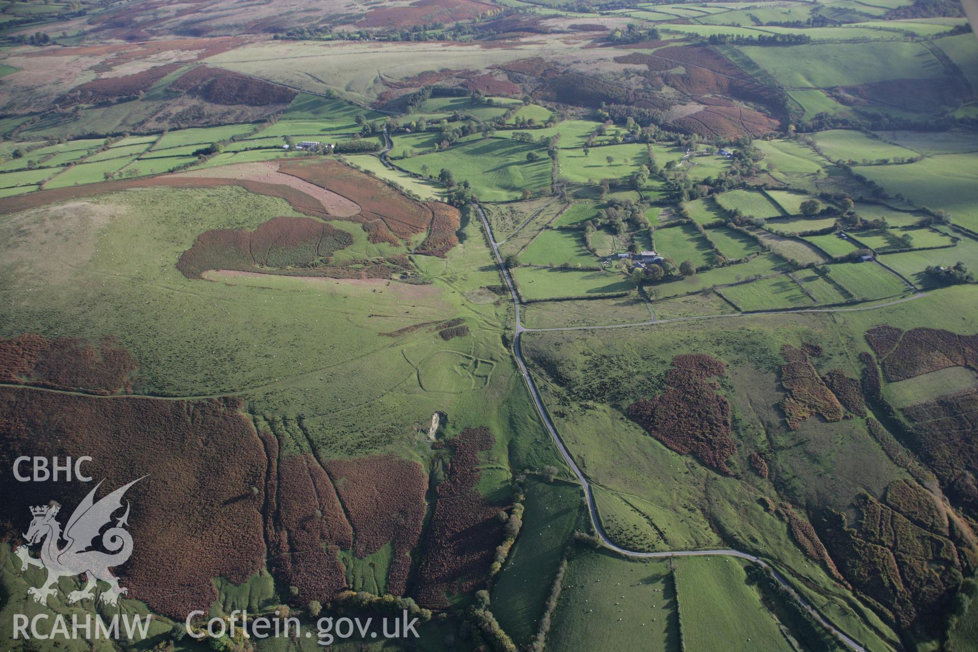 RCAHMW colour oblique aerial photograph of Moelfre Hill Deserted Rural Settlement, in wide view looking south. Taken on 13 October 2005 by Toby Driver