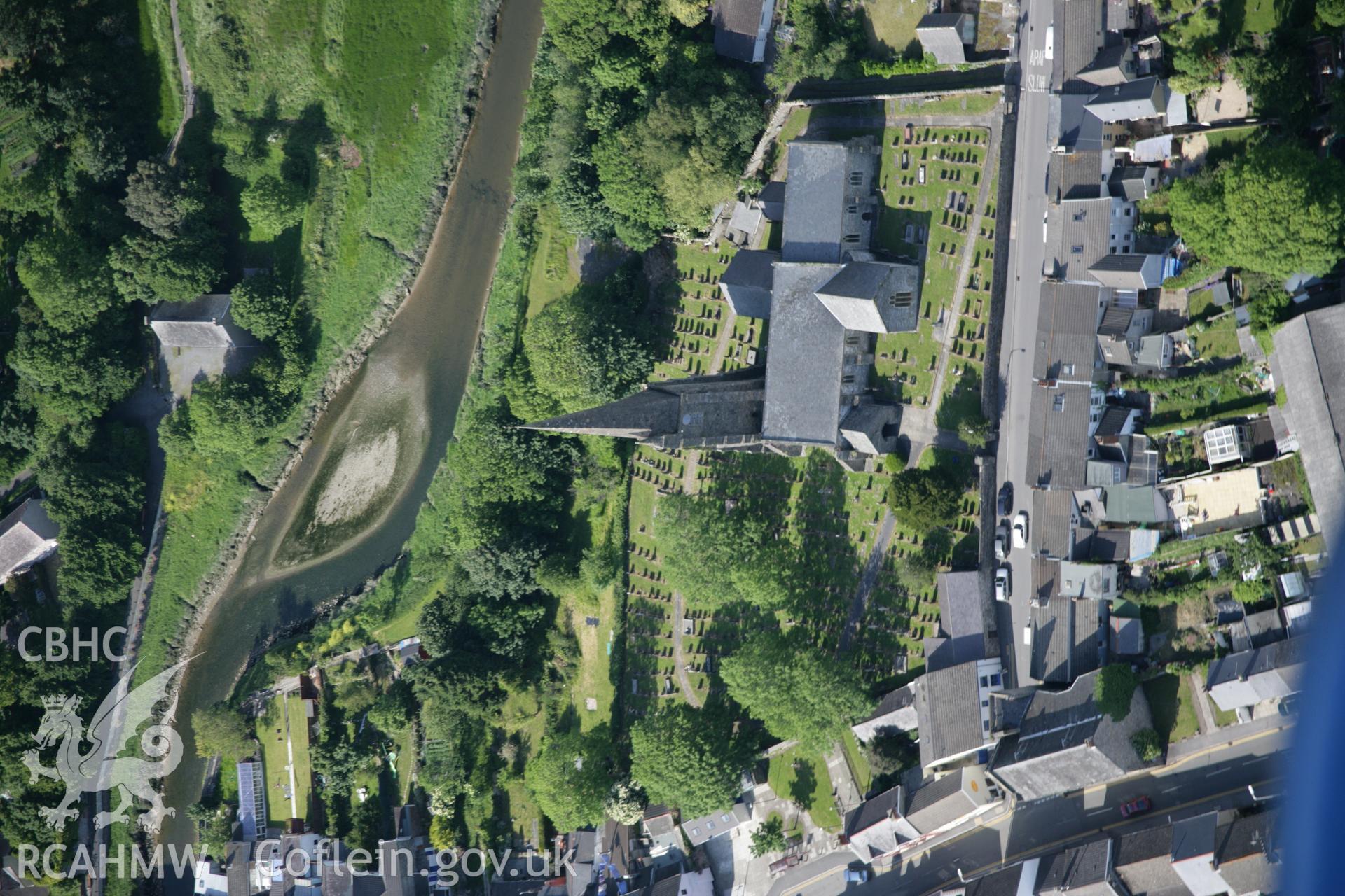 RCAHMW colour oblique aerial photograph of St Mary's Church, Kidwelly (Benedictine Priory). Taken on 09 June 2005 by Toby Driver