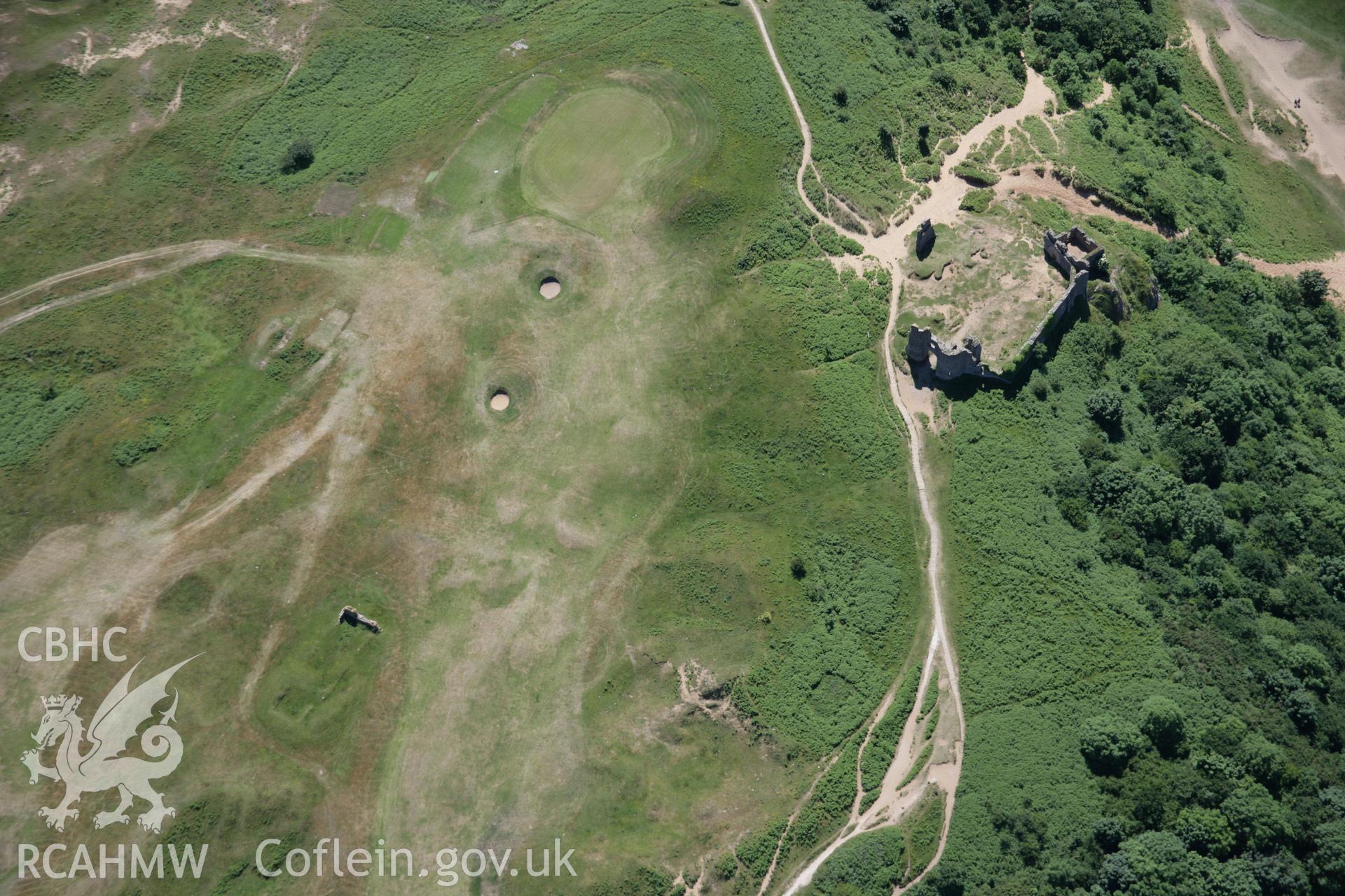 RCAHMW colour oblique aerial photograph of Pennard Castle and church. Taken on 22 June 2005 by Toby Driver