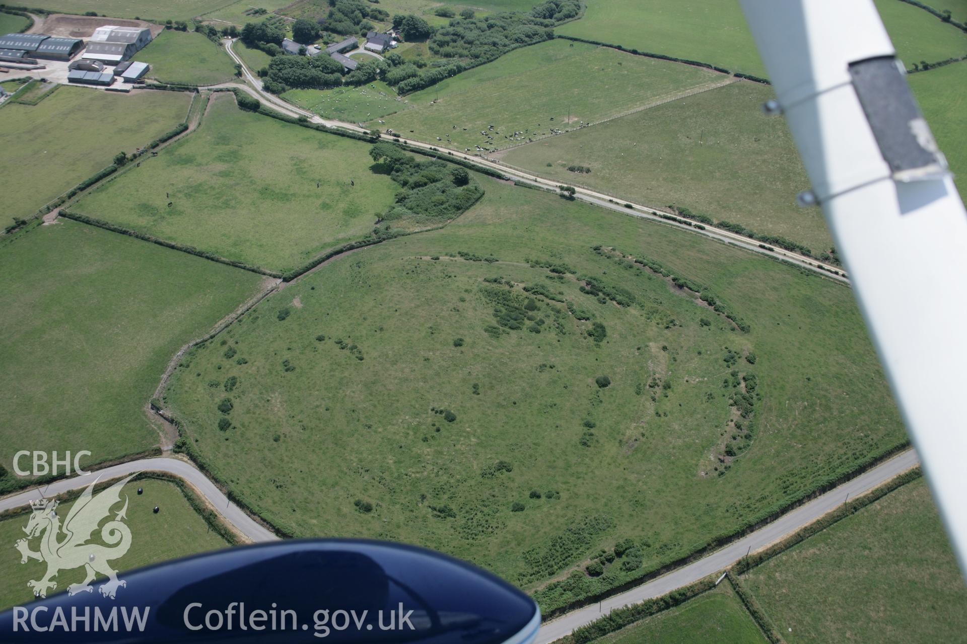 RCAHMW colour oblique aerial photograph of Caerau, Moylgrove from the north. Taken on 11 July 2005 by Toby Driver