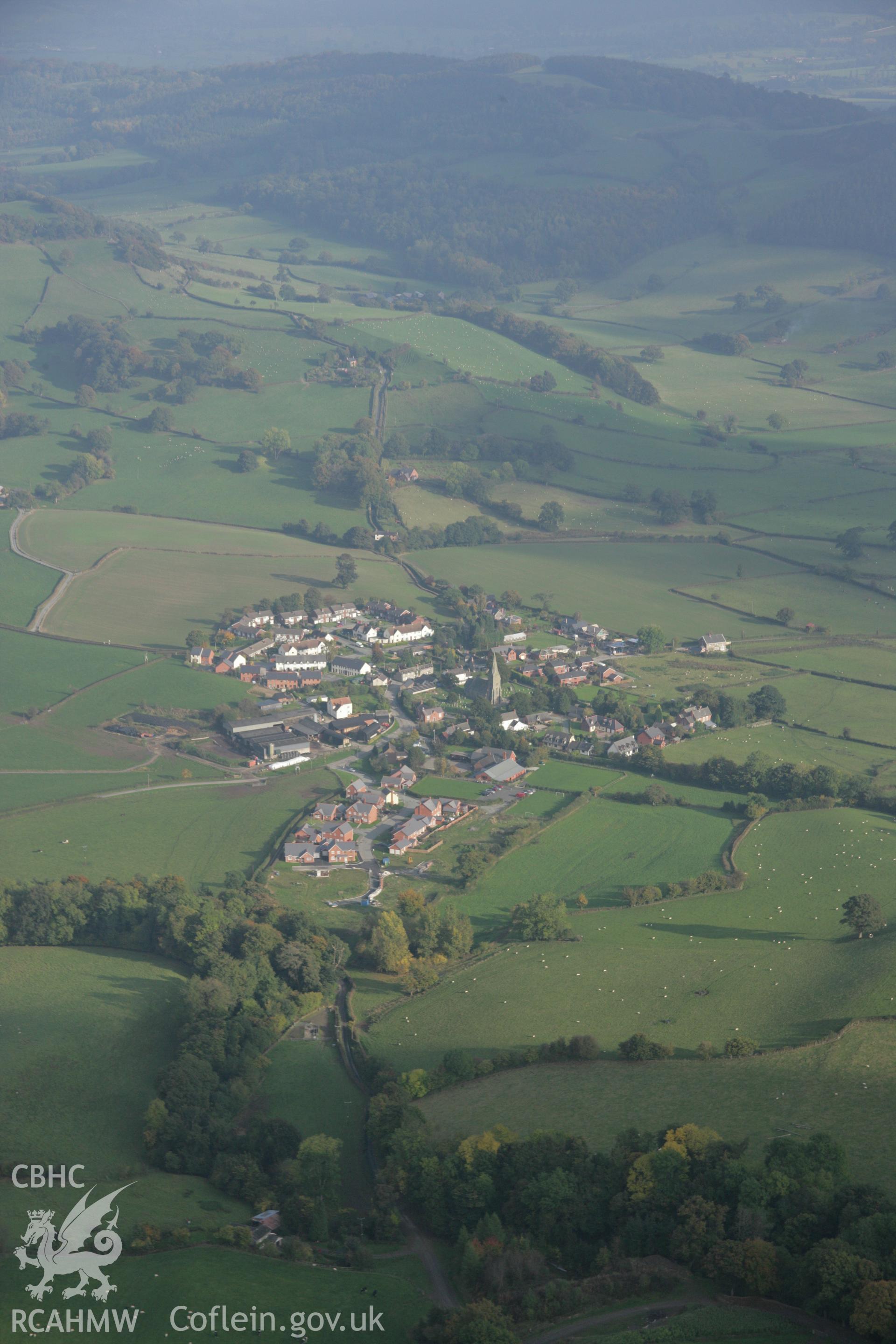 RCAHMW colour oblique aerial photograph of Castle Caereinion Castle and village from the west. Taken on 17 October 2005 by Toby Driver