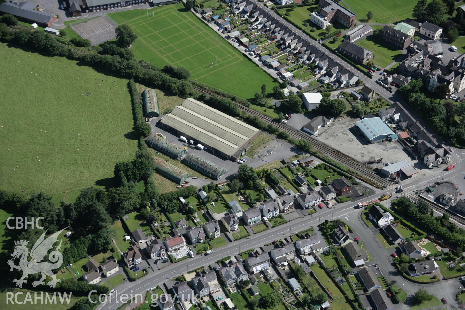 RCAHMW colour oblique aerial photograph of Llandovery Railway Station and sheds viewed from the north-west. Taken on 02 September 2005 by Toby Driver