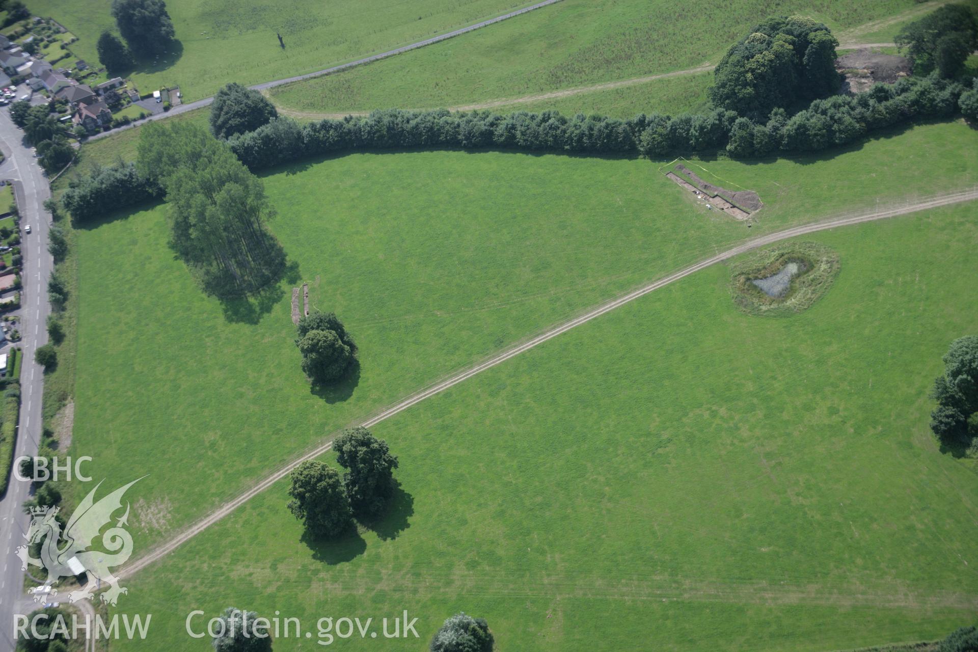 RCAHMW colour oblique aerial photograph of Dinefwr Park Roman Forts. The main excavation trenches viewed from the north-east. Taken on 11 July 2005 by Toby Driver