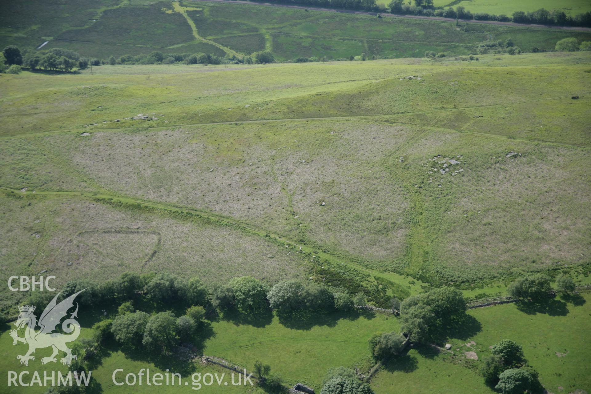 RCAHMW colour oblique aerial photograph of Graig Fawr Chambered Tomb from the south-east. Taken on 09 June 2005 by Toby Driver