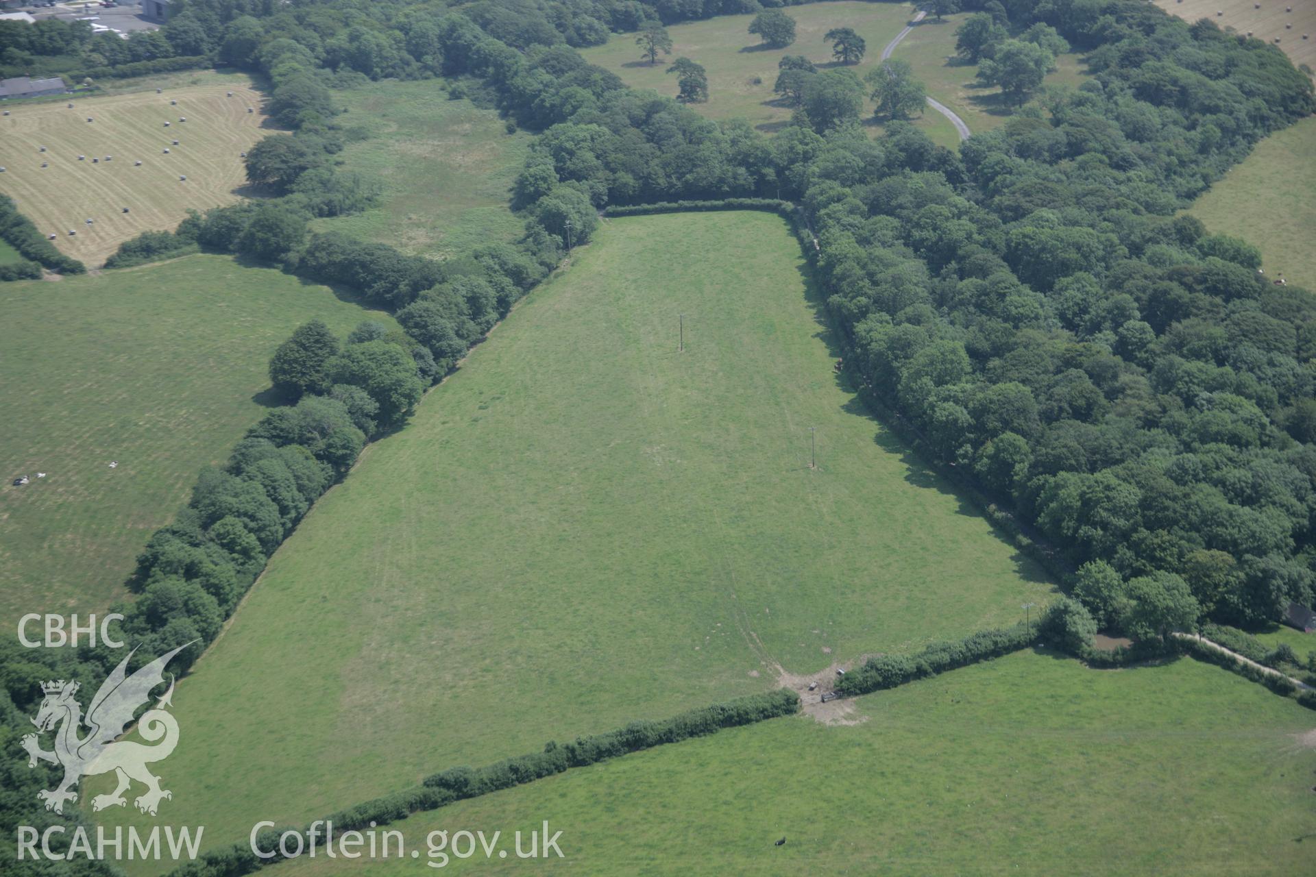 RCAHMW colour oblique aerial photograph of a pit circle 250m northeast of Cottesmore Farm. Taken on 11 July 2005 by Toby Driver