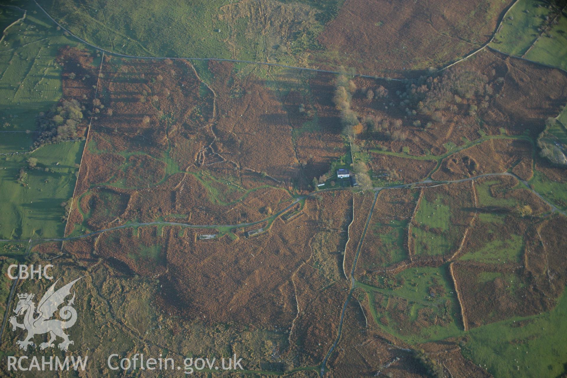 RCAHMW colour oblique aerial photograph of an enclosed hut group northeast of Caer Mynydd viewed from the north-west. Taken on 21 November 2005 by Toby Driver