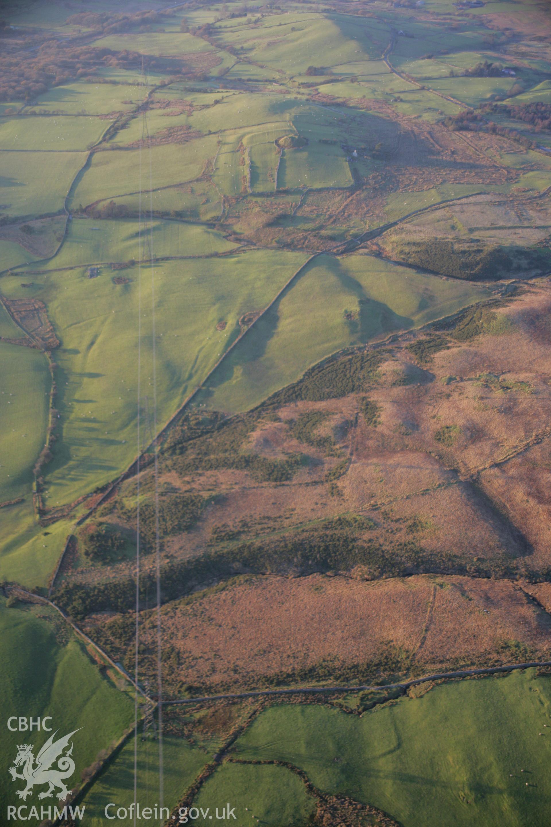 RCAHMW colour oblique aerial photograph of possible Roman Marching Camps east of Tomen-y-Mur, from the south-east. Taken on 21 November 2005 by Toby Driver