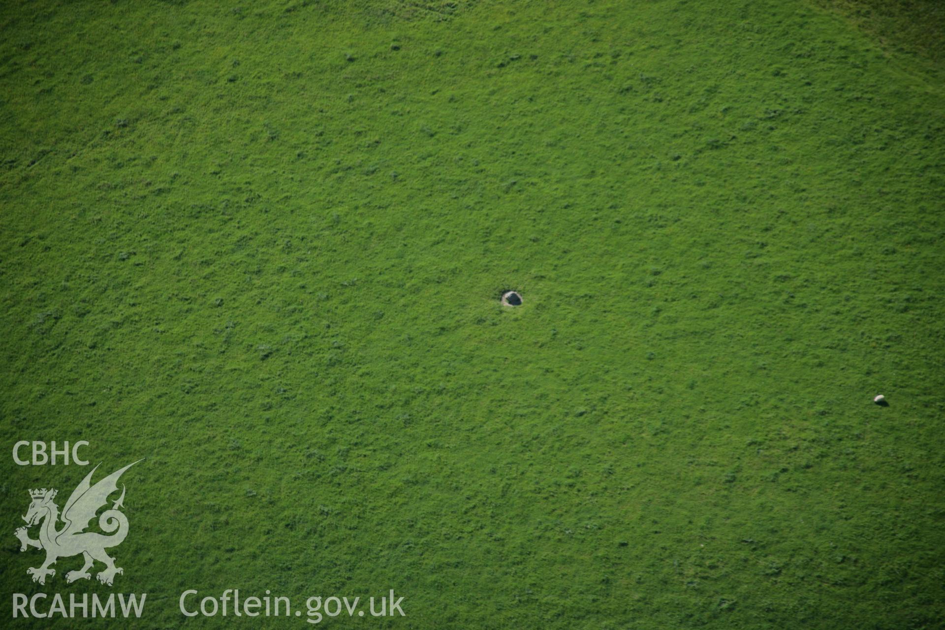 RCAHMW colour oblique aerial photograph of Lower Court Standing Stone. Taken on 09 June 2005 by Toby Driver