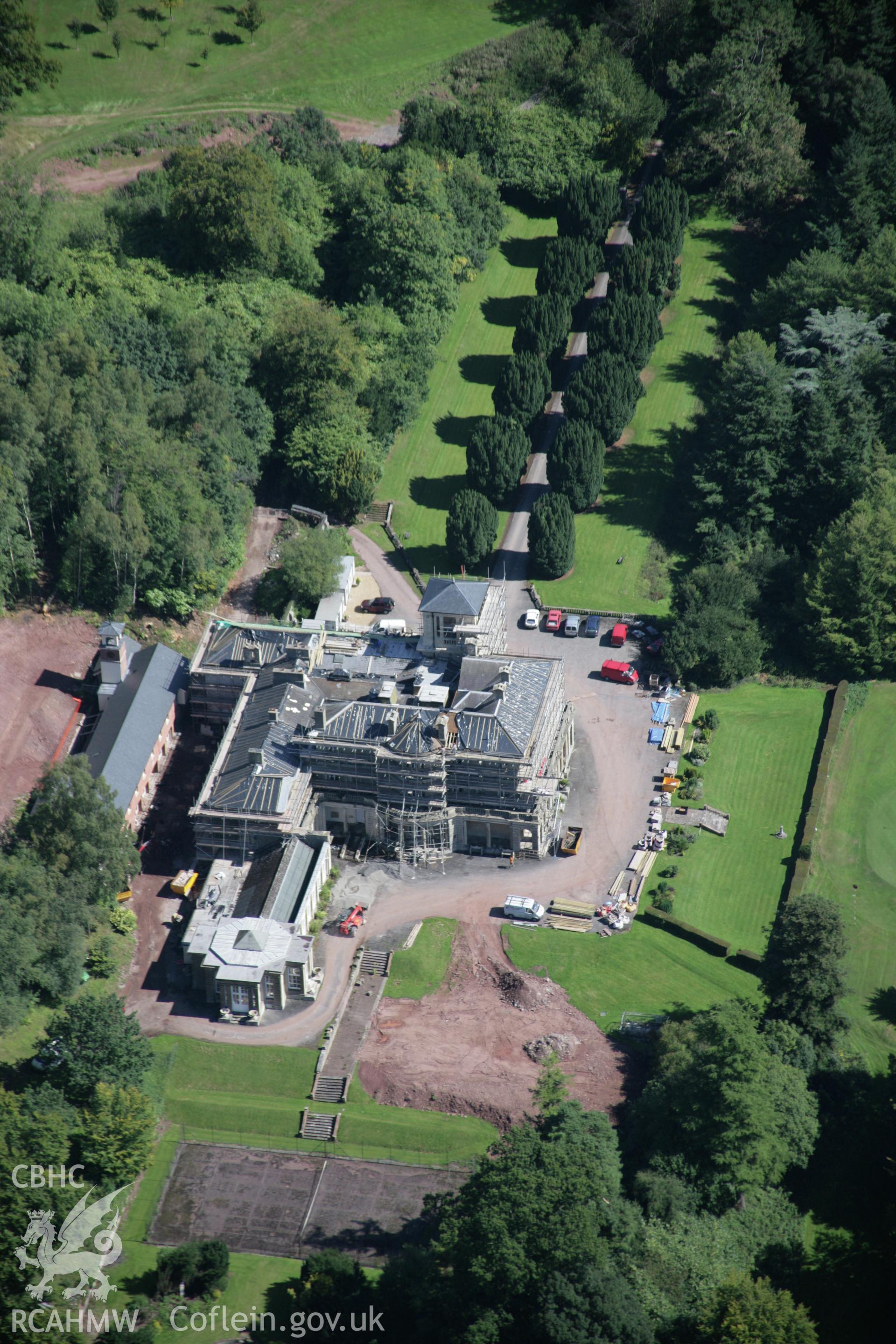 RCAHMW colour oblique aerial photograph of Penoyre Country House and avenue, in general view from west. Taken on 02 September 2005 by Toby Driver