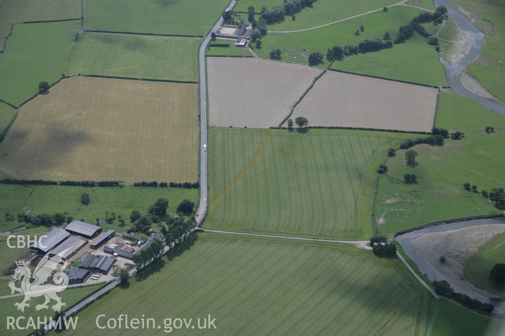 RCAHMW digital colour oblique photograph of section of Roman road visible as a cropmark at Red House viewed from the east. Taken on 18/07/2005 by T.G. Driver.