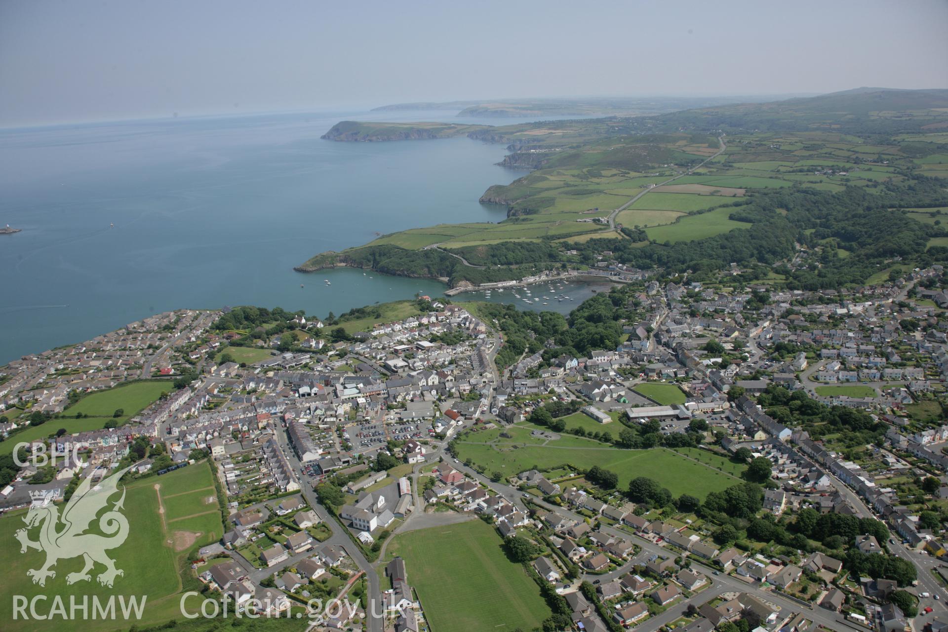 RCAHMW colour oblique aerial photograph of Fishguard. A general view from the west with the North Pembrokeshire coast beyond. Taken on 11 July 2005 by Toby Driver