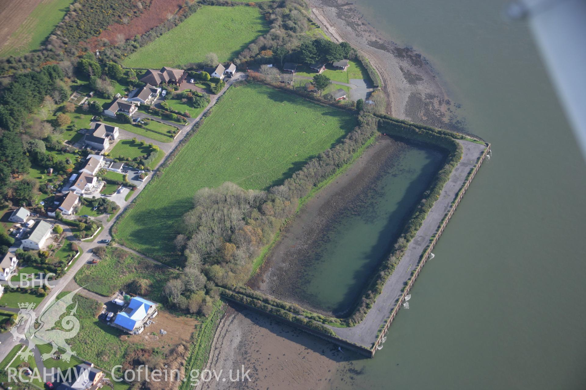 RCAHMW colour oblique aerial photograph of Burton Ferry NATO Quay from the west.. Taken on 19 November 2005 by Toby Driver