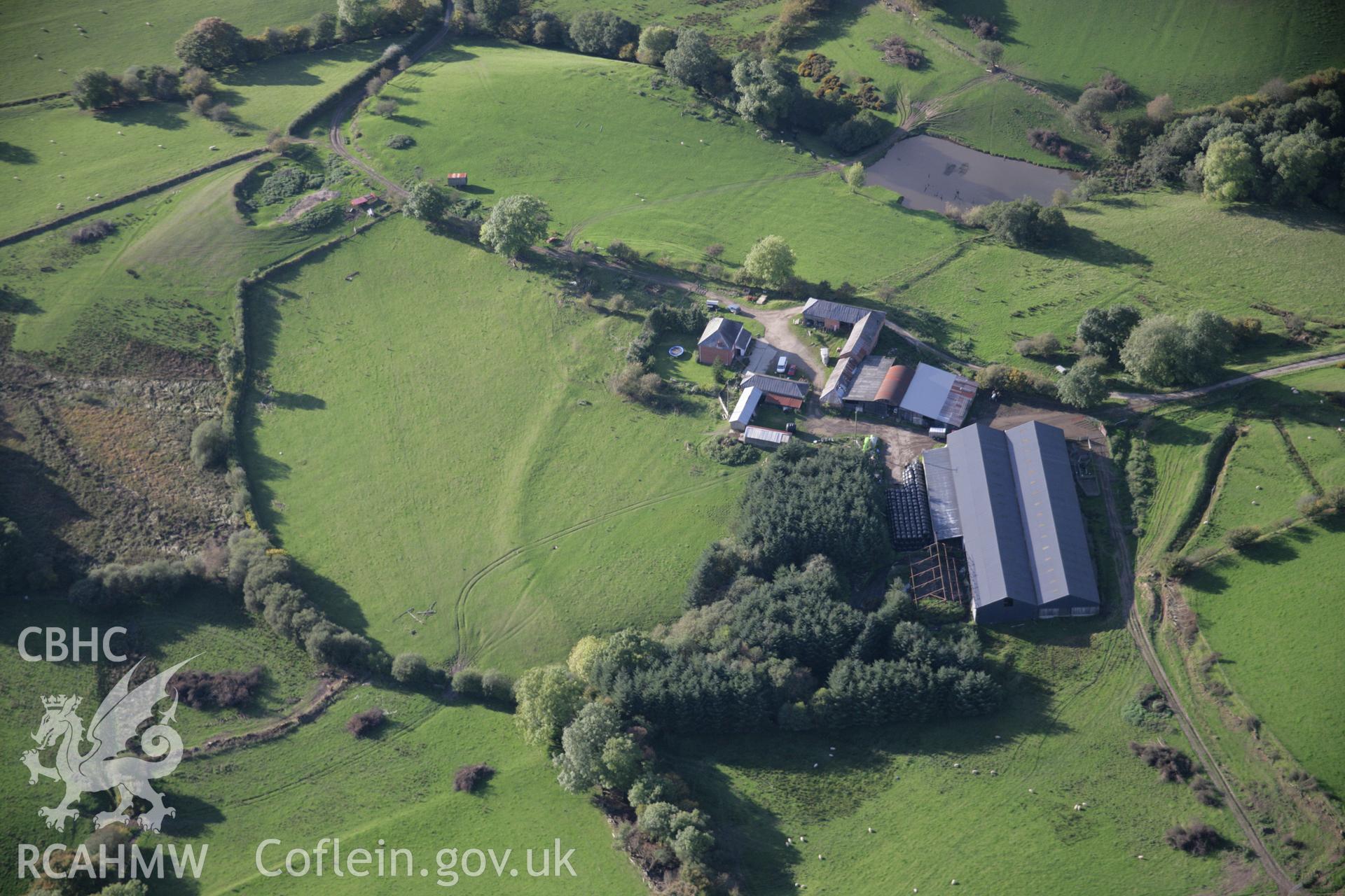 RCAHMW colour oblique aerial photograph of Cwm-Cefn-y-Gaer Farmstead, west of Heartsease, with the earthwork of a possible fort or relict field boundary. Viewed from the south-east. Taken on 13 October 2005 by Toby Driver