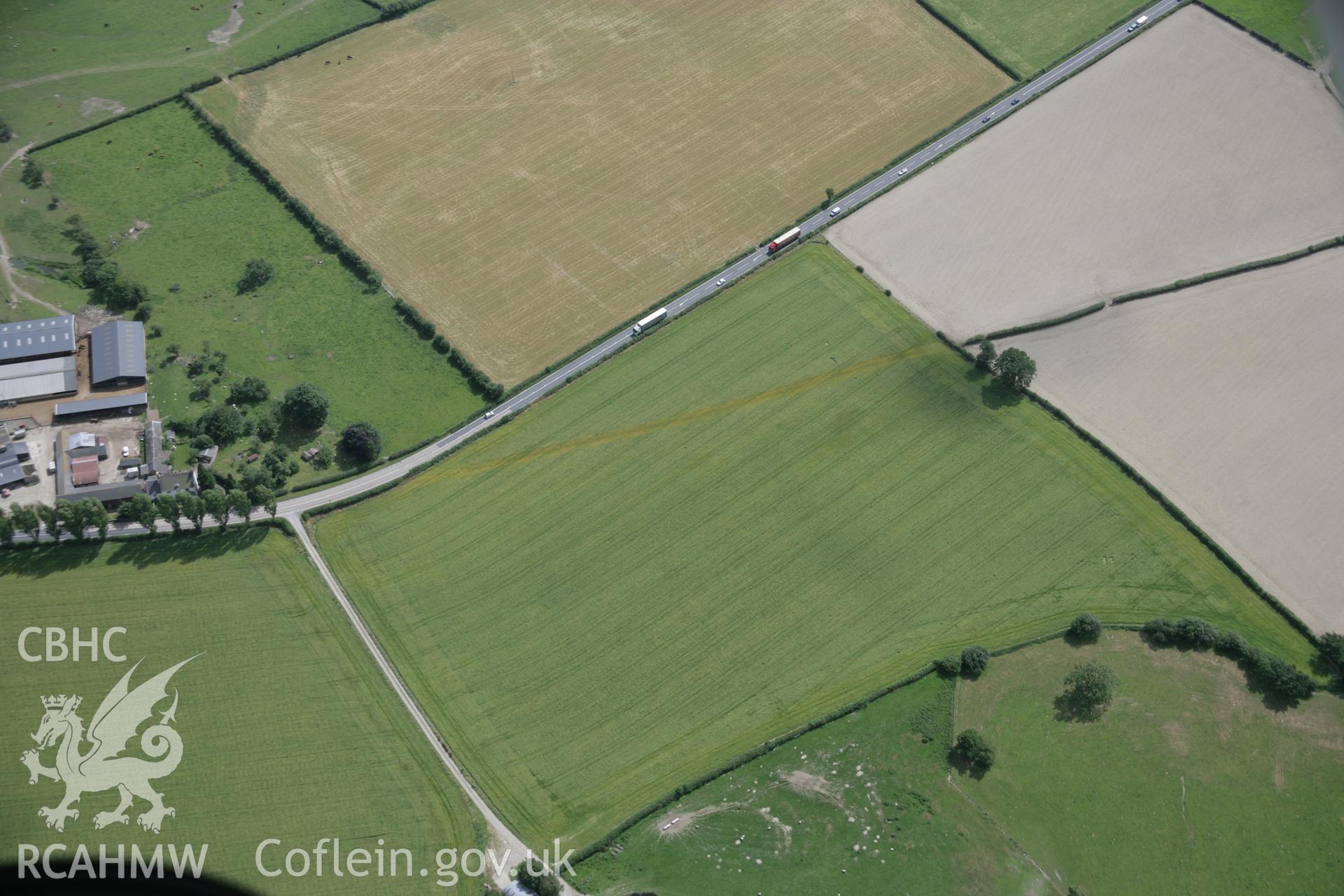 RCAHMW digital colour oblique photograph of section of Roman road visible as a cropmark at Red House viewed from the north-east. Taken on 18/07/2005 by T.G. Driver.