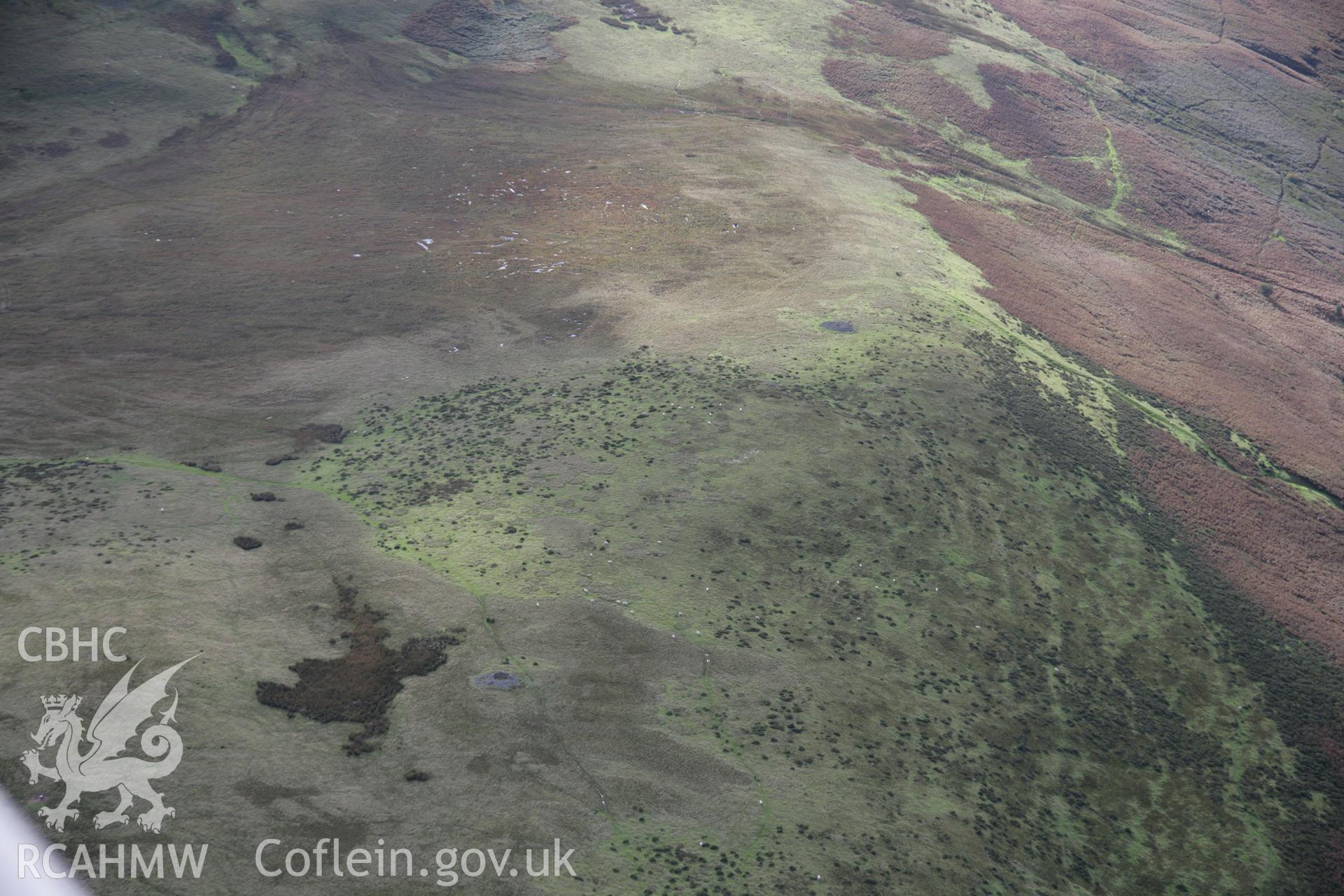 RCAHMW colour oblique aerial photograph of Banc Ystrad Wen, Cairns I, II, II and IV viewed from the east. Taken on 13 October 2005 by Toby Driver